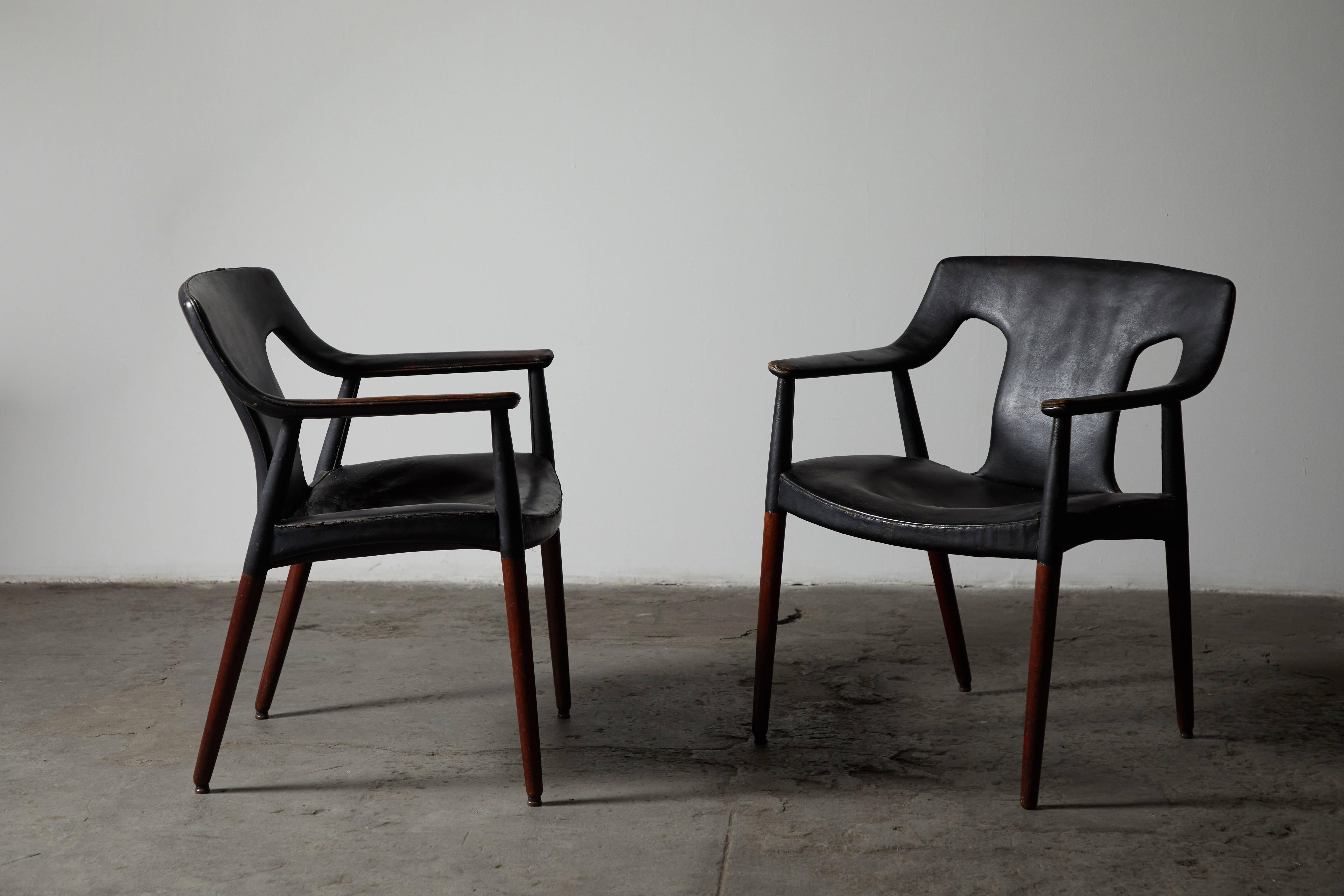 Rare pair of leather and rosewood lounge chairs by Aksel Bender Madsen and Ejner Larsen. Made in Denmark, circa 1956.
 