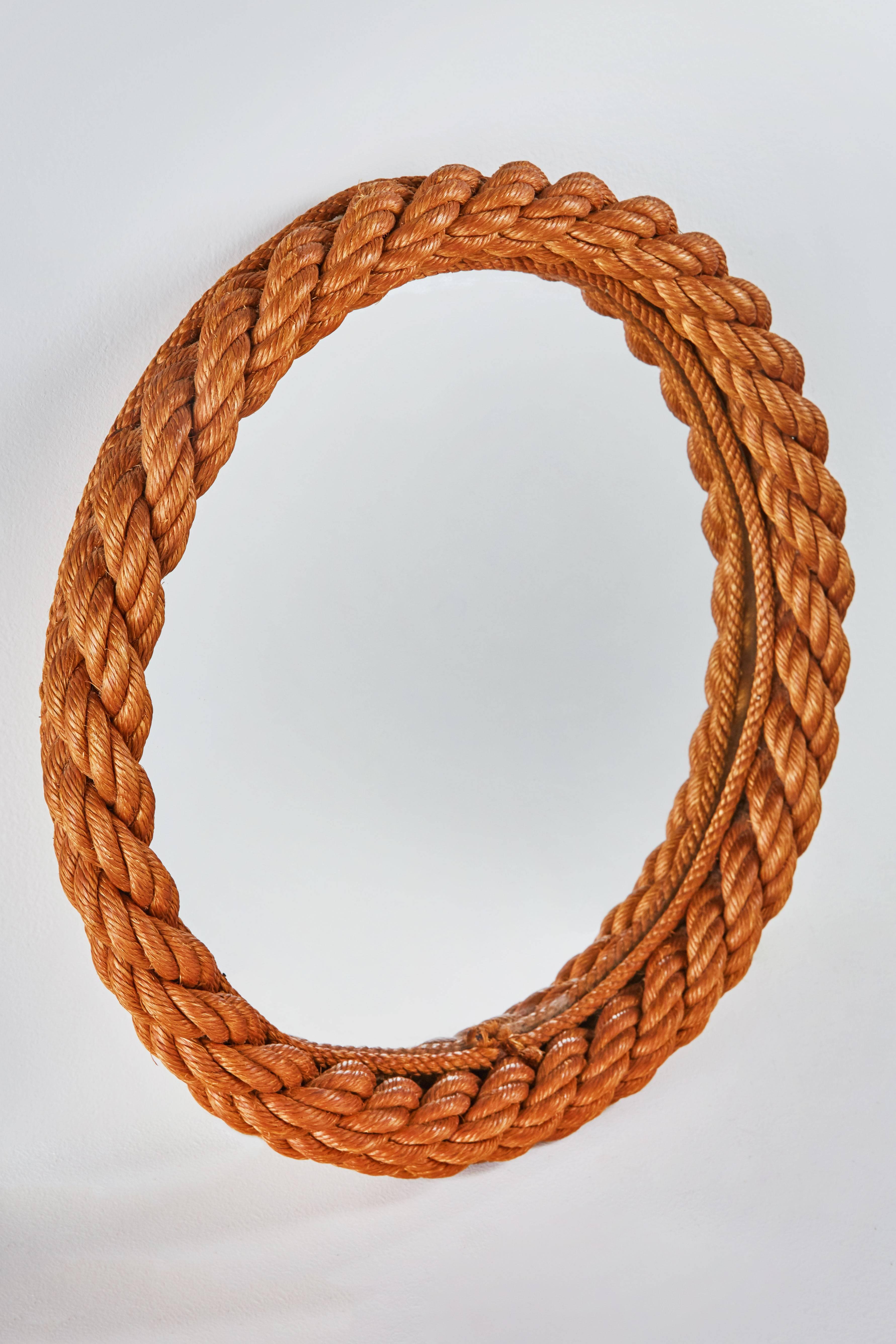 Circular rope mirror by Audoux-Minet. Simple frame made of woven abaca in Golfe-Juan, France, circa 1950s.

One is slightly smaller at 17.5” diameter.

 