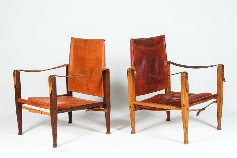 Kaare Klint Safari Chairs for Rud Rasmussen with original patinated leather and wood legs. Made in Denmark, circa 1940s.

