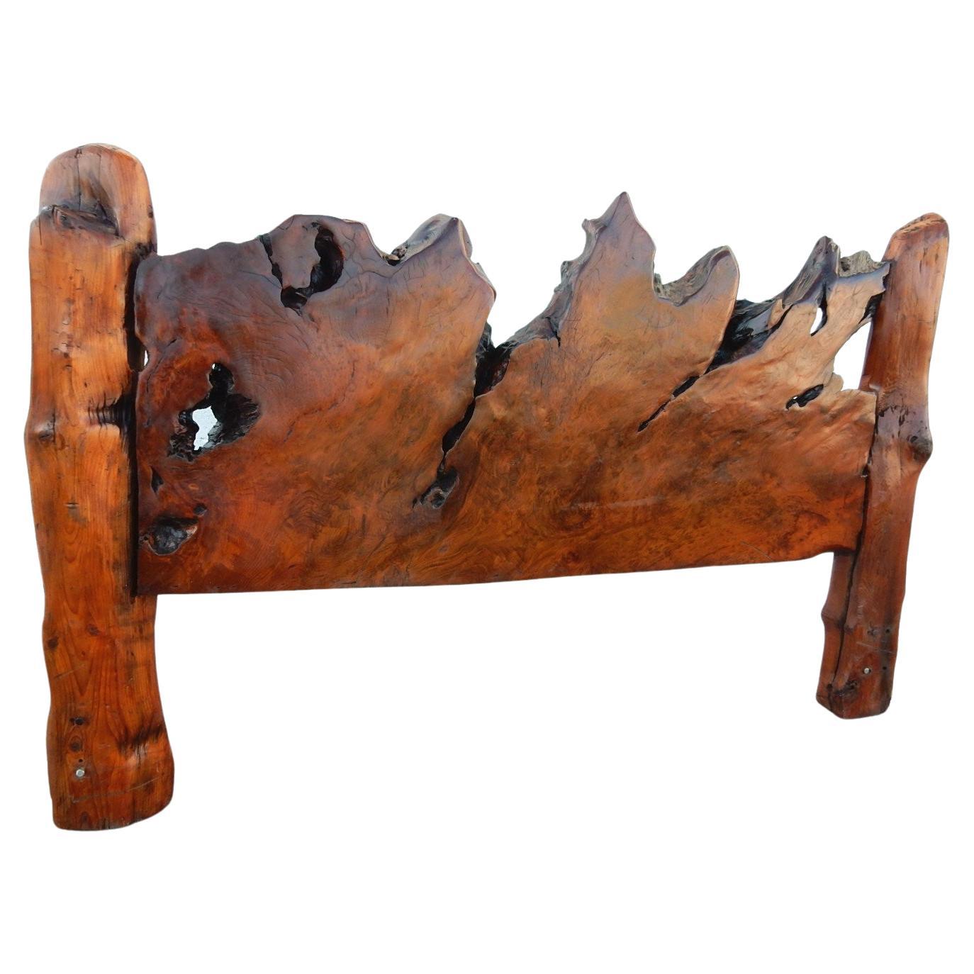Handcrafted California redwood live edge burl headboard and footboard
by famed sculptor Steven Siegel for Burl Bros, circa 1970s.
King-size adjustable holes for regular or Cal king frame.
This piece is amazing, organic, completely original,