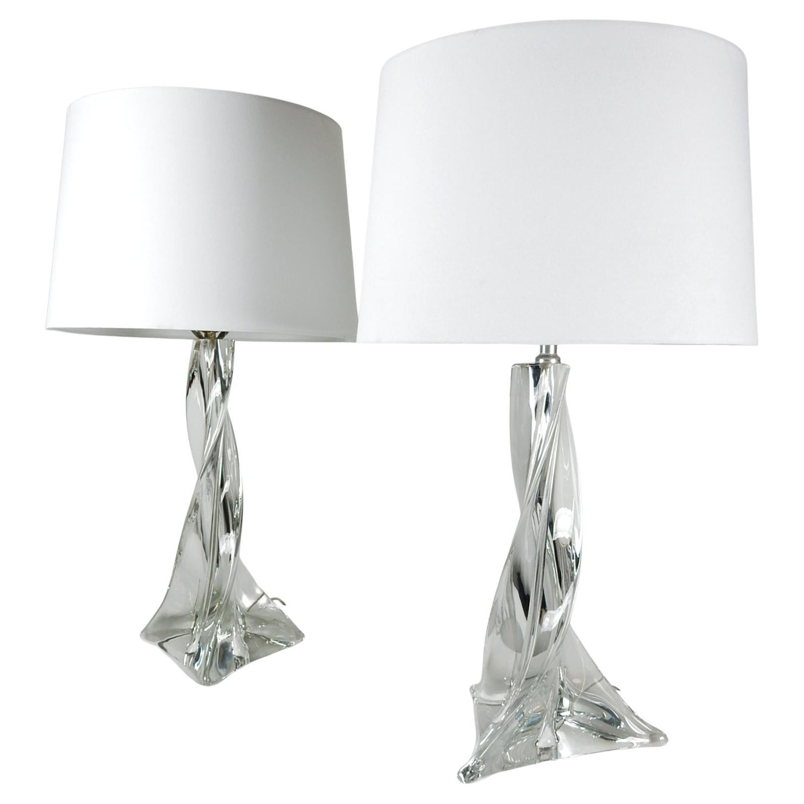 Large pair of Saint-Louis crystal of France spiraling art glass table lamps.
Gorgeous solid crystal that dazzles in light. Glass body of lamps stand 16 inch tall.
Etched signed on base of one lamp, as pictured. 
Shades pictured not original nor