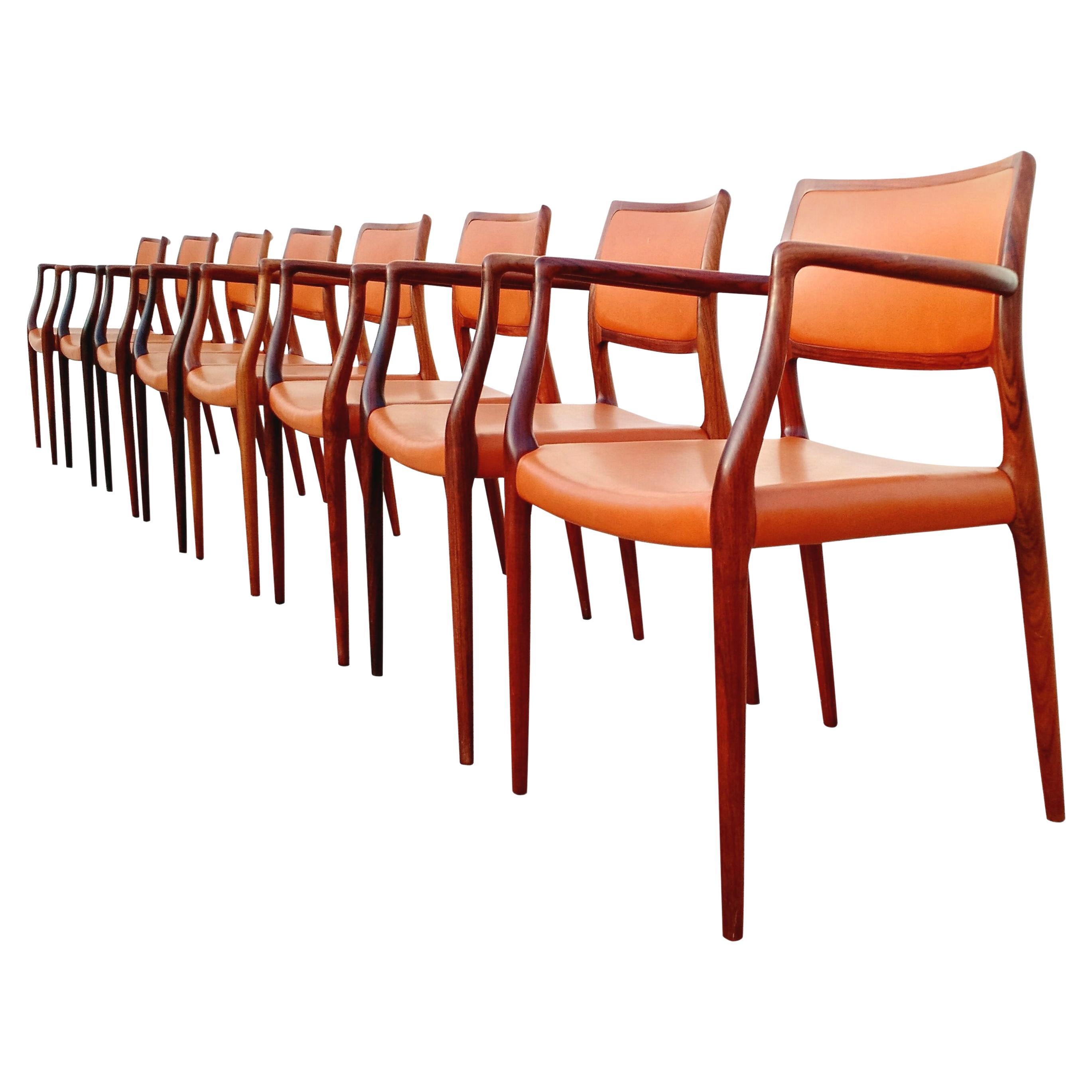 8 Danish Modern Niels Otto Møller Sculpted Rosewood Dining Arm Chairs For Sale