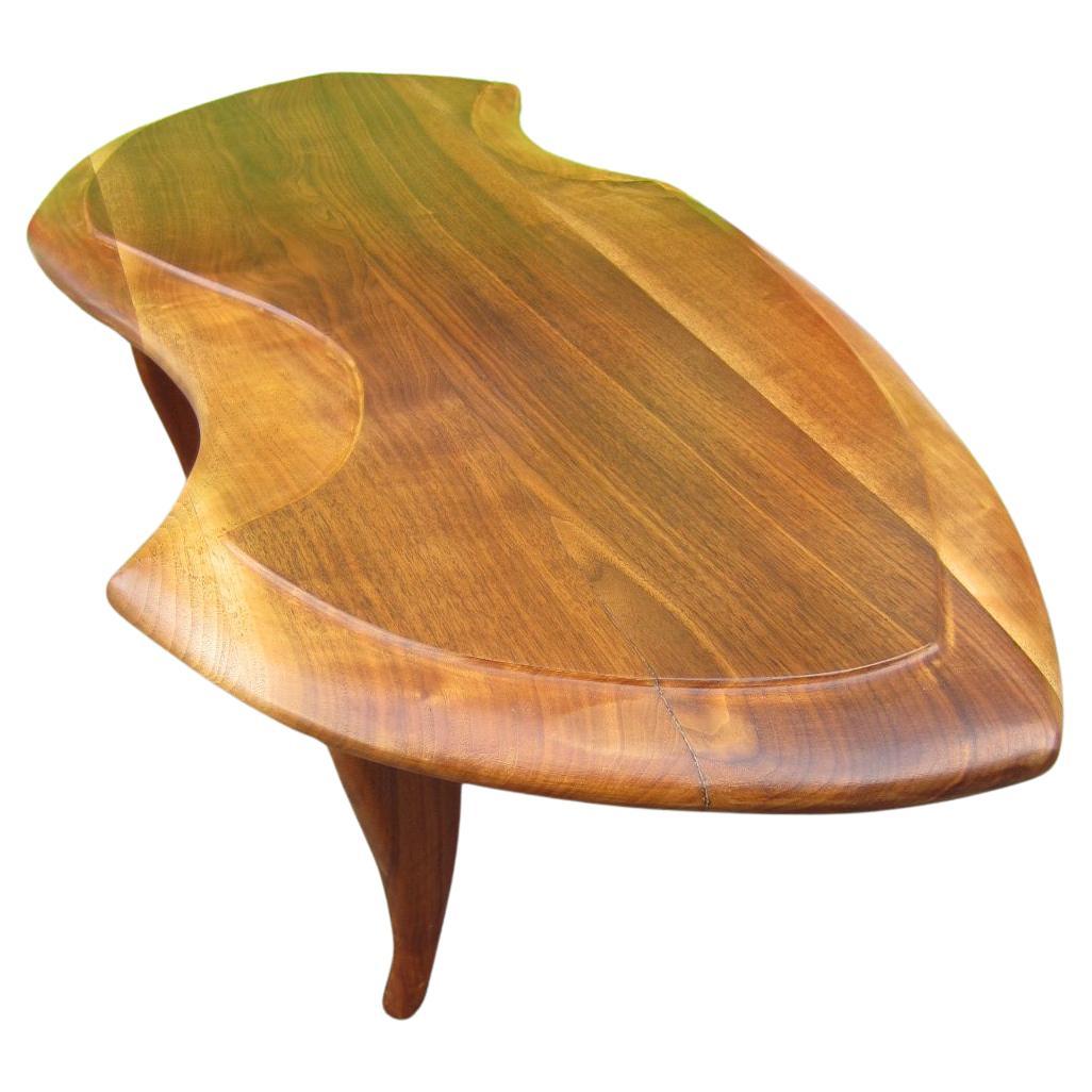 Amazing biomorphic sculptural coffee table buy designer Ray Leach, circa 1950.
A spectacular piece of art furniture. Each piece by Ray was individually crafted and unique.
Sculpted of solid walnut, this has been refinished/stripped(found painted