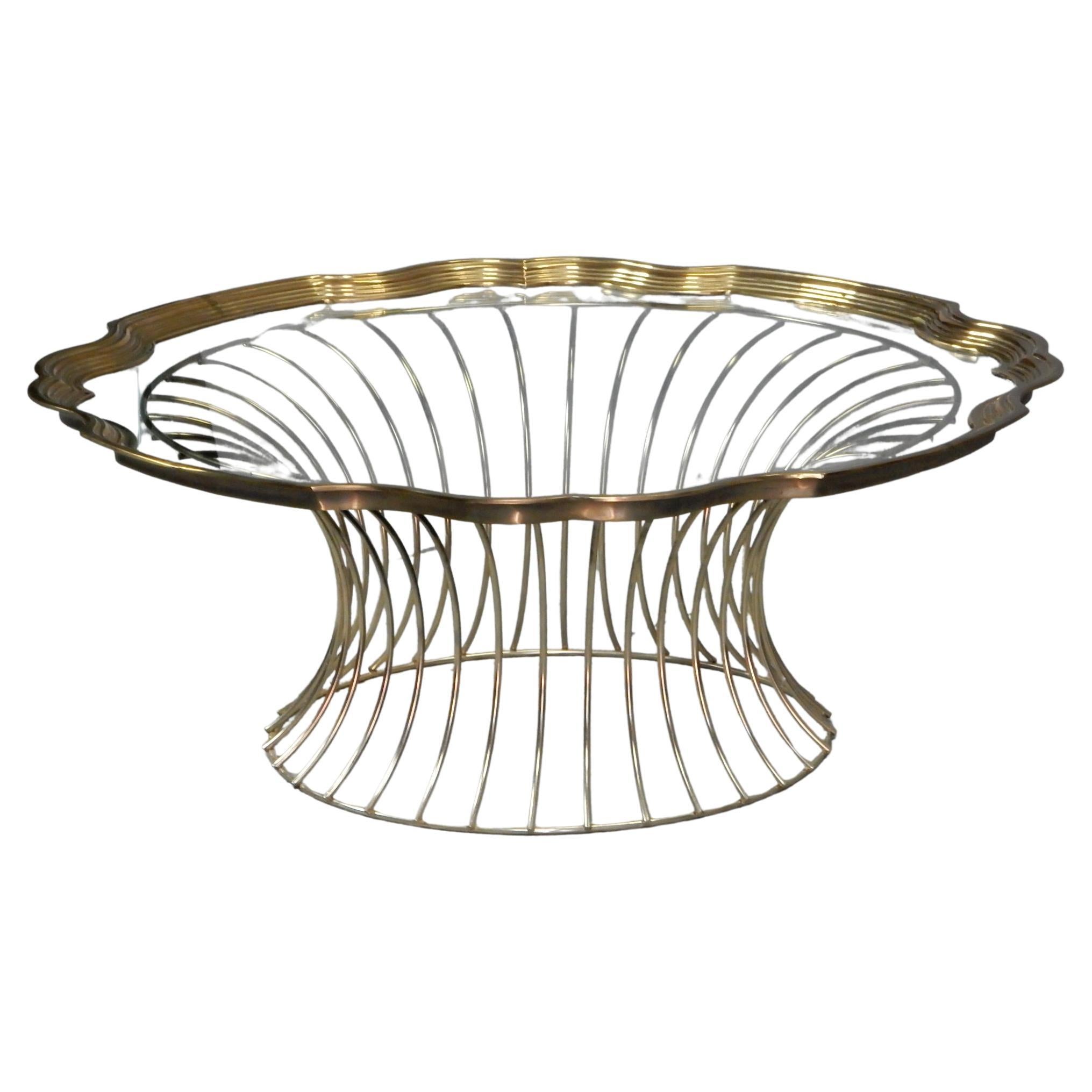 Aesthetically pleasing brass wire and framed glass tray coffee table.
Exceptional quality, circa 1960's. 47
