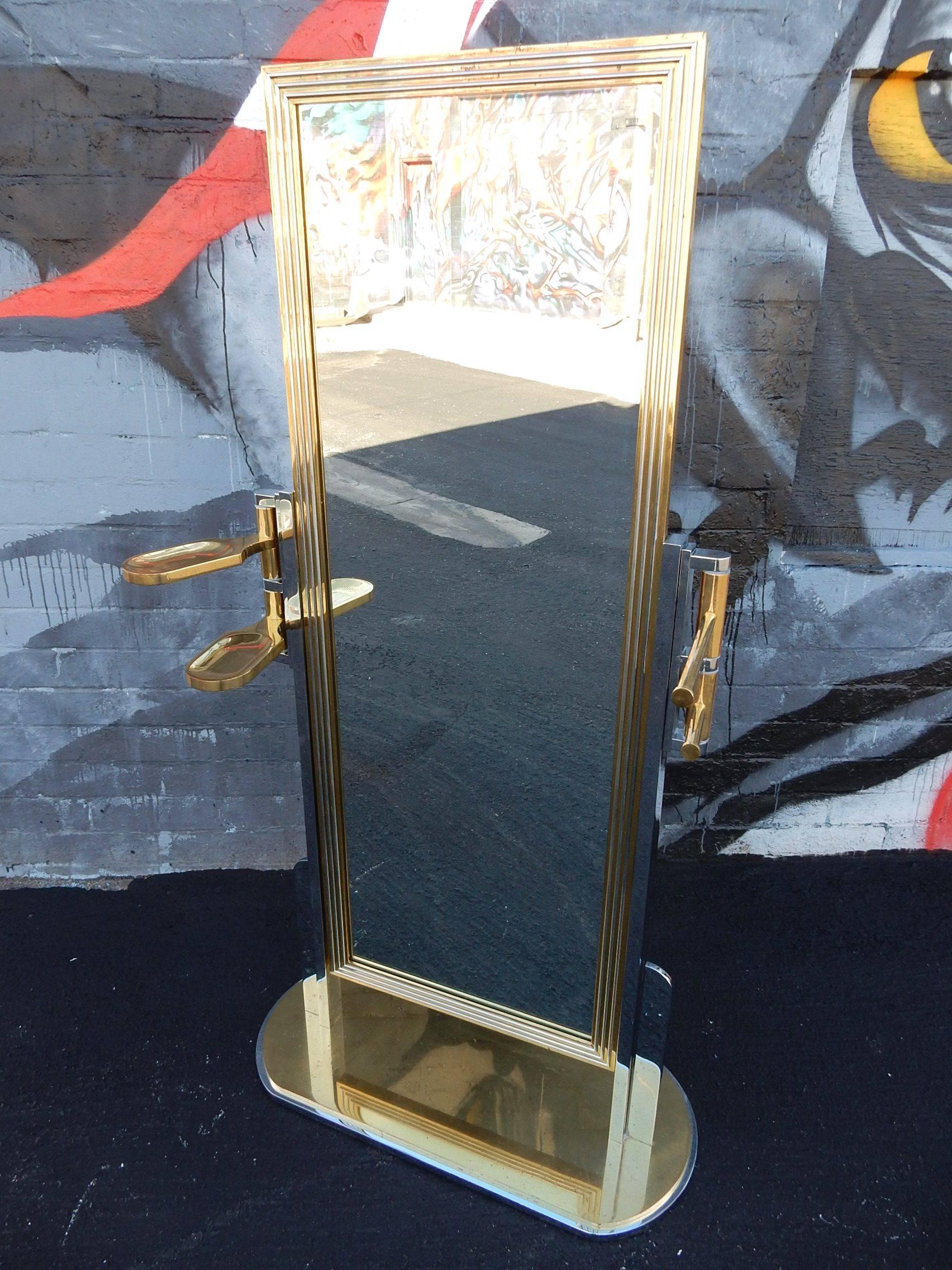 Incredible solid brass and chromed steel full length dressing mirror with side holders for cuff links, pants, belt etc.
The ultimate Men's valet. Circa 1970's in a classic Art Deco skyscraper style.
Not signed or marked. An outstanding quality
