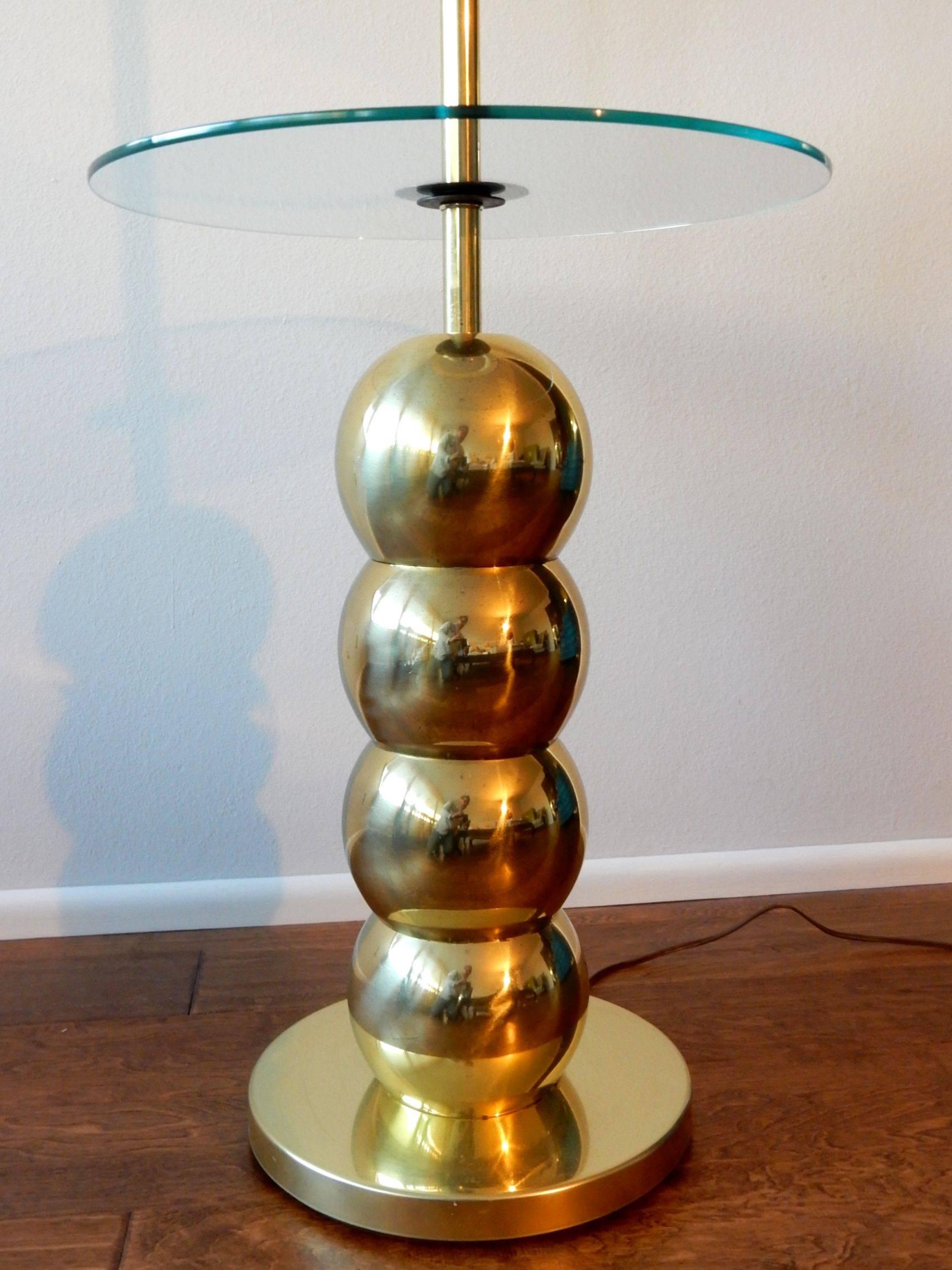 Rare brass stacked ball floor lamp/table designed by George Kovacs circa 1969.
Floating 16