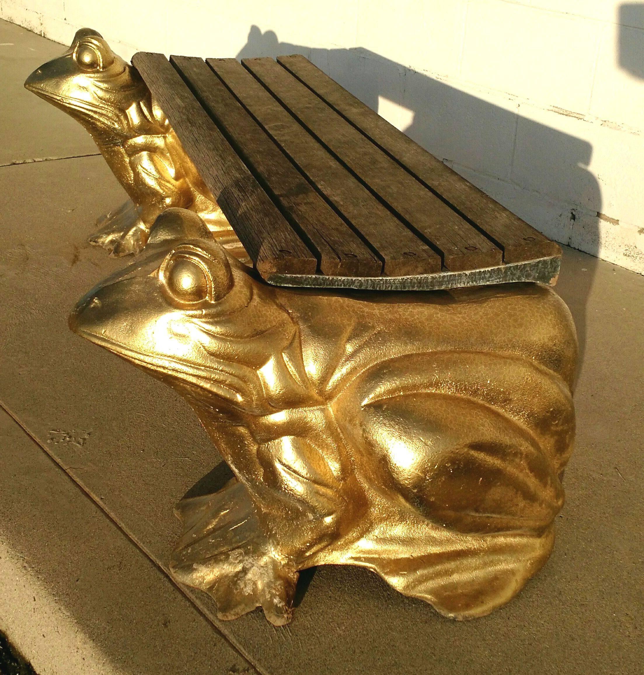 Sculptural garden bench formed of cast iron with attached slat wood seating area.
Toads are covered in a golden enamel paint.
This set is very heavy. Unsigned