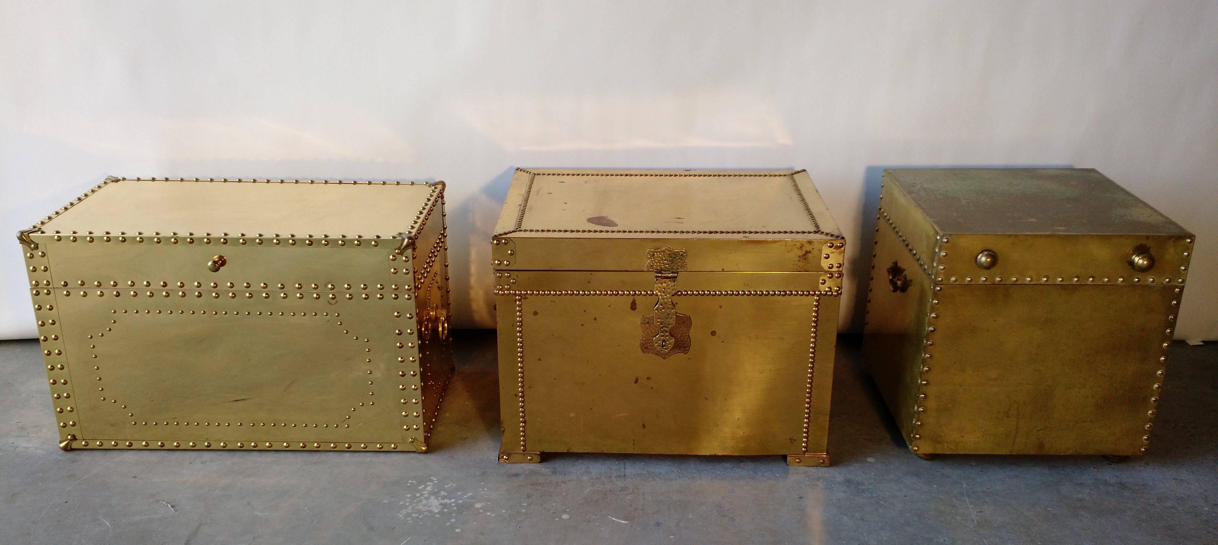 What's better than a stack of vintage brass clad nailhead trunks?
Perfect decor pieces. Could be lined up and used as a coffee table or side tables.
All three are vintage, circa 1970s or older. All nails, handles, feet, latches etc are in