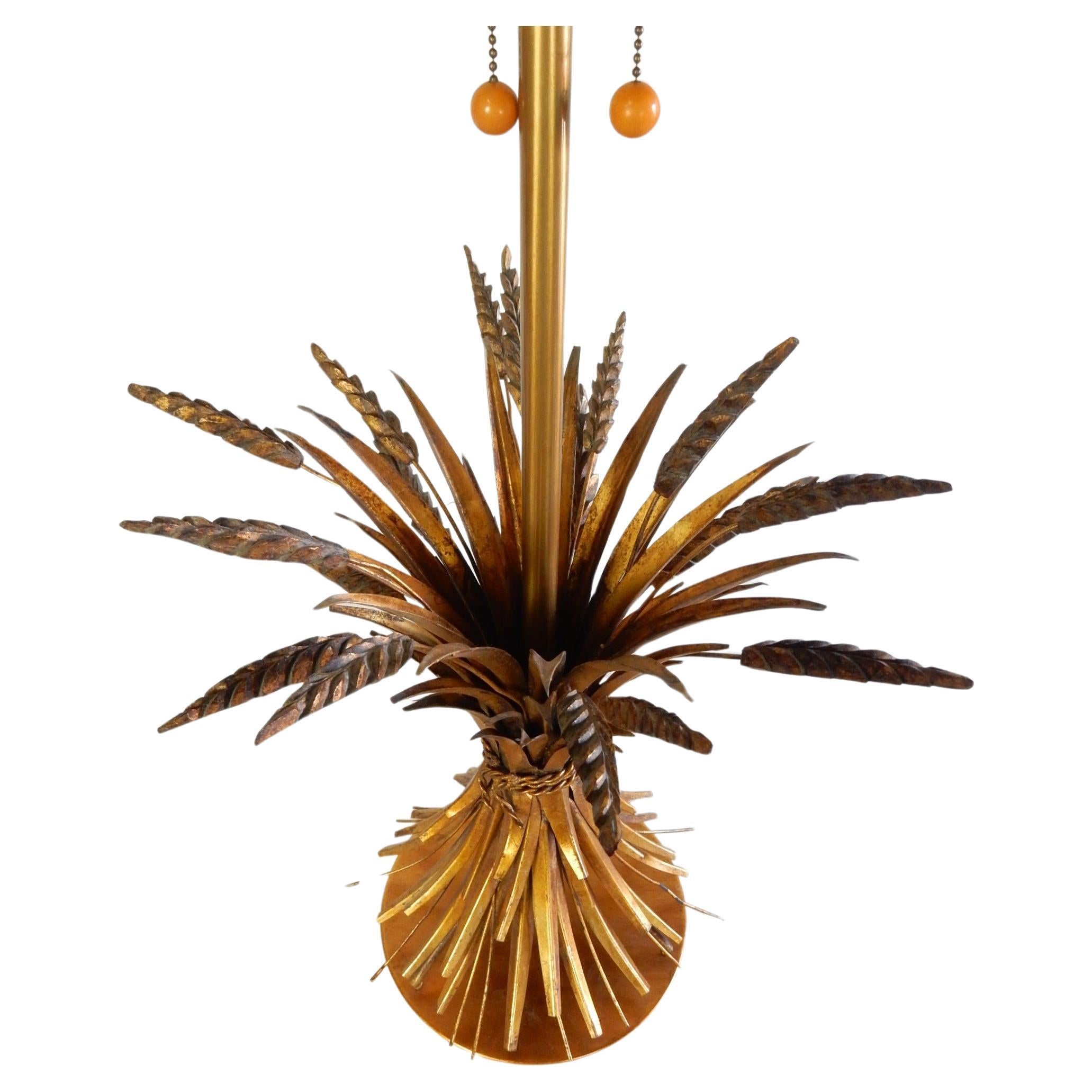 Exquisite pair of ~Sheaf of Wheat~ table lamps designed by the Marbro Lamp Company of Los Angeles circa 1960.
These are exceptional large-scale table lamps made of metal with gold gilt enamel. Adds sophistication to any style decor. 
Includes their