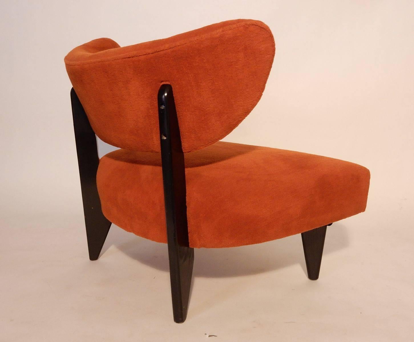 Incredible pair of low and wide 1950s lounge chairs in the manner of Billy Haines design.
Orange wool upholstery and ebonized oak legs appear to be all original. 
Very clean chairs and super comfortable. Marked 