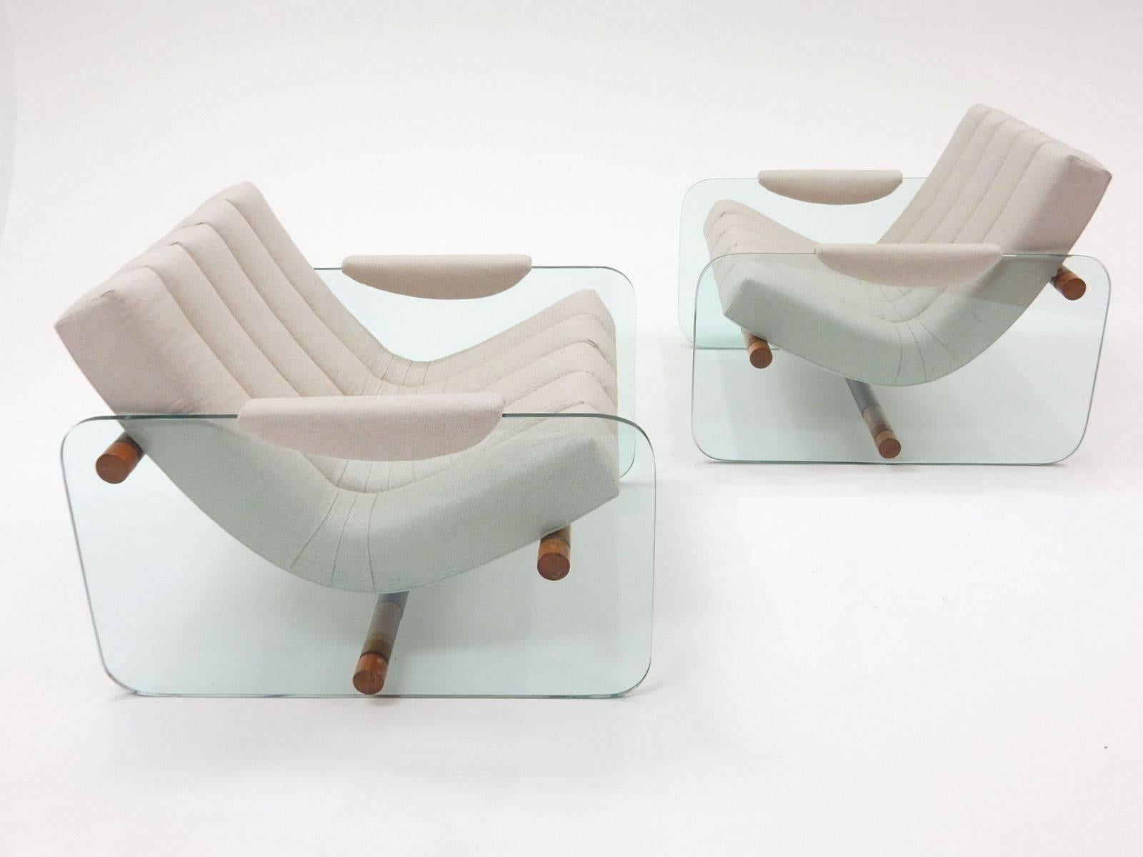 A pair of glass, wood and upholstered lounge chairs in the style of Italian designer Fabio Lenci (1935-).
3/4