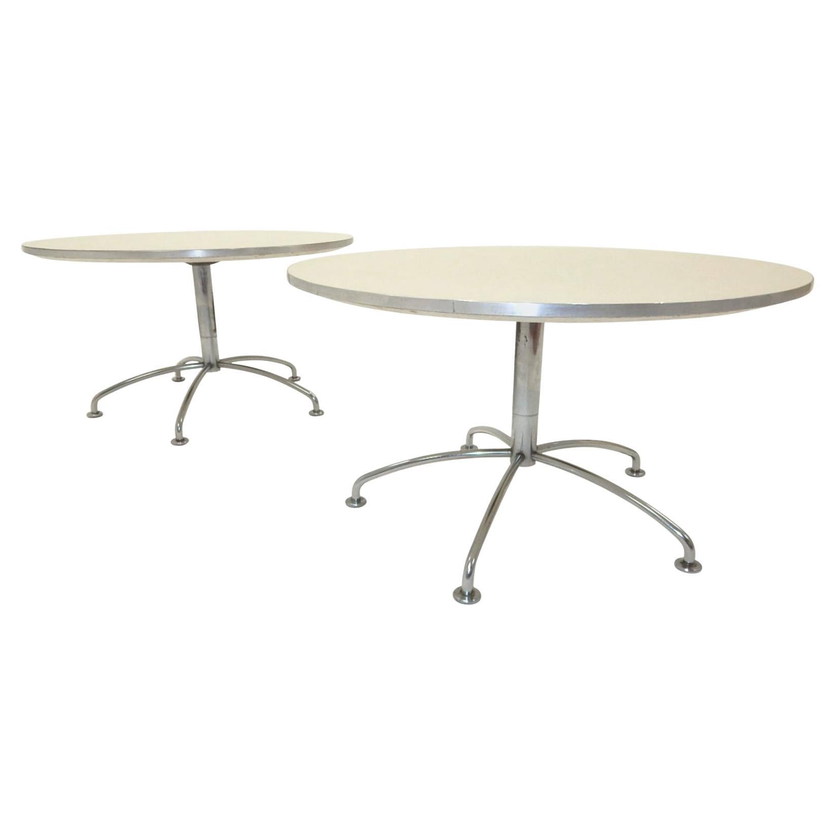 A pair of spider leg side table designed by Fritz Hansen for the lounge at Scandinavian Airlines in Denmark.
Nickel-plated base with enameled wood top trimmed in aluminum.
Labeled on bottoms 