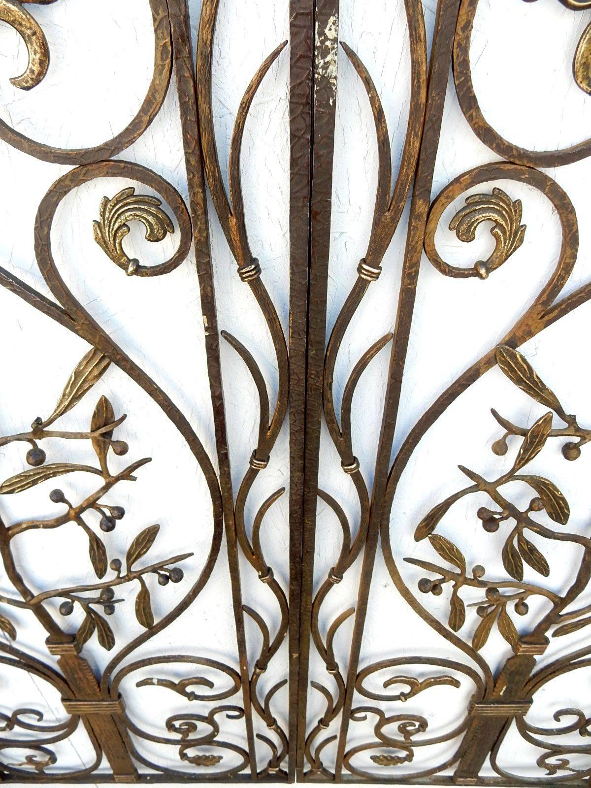 Incredible, early 1900s French artistic iron garden gate with bronze fleur-de-lis, berry bush and florets. 
Maker’s mark stamped on top edge is a two-barred cross (the Cross of Lorraine).