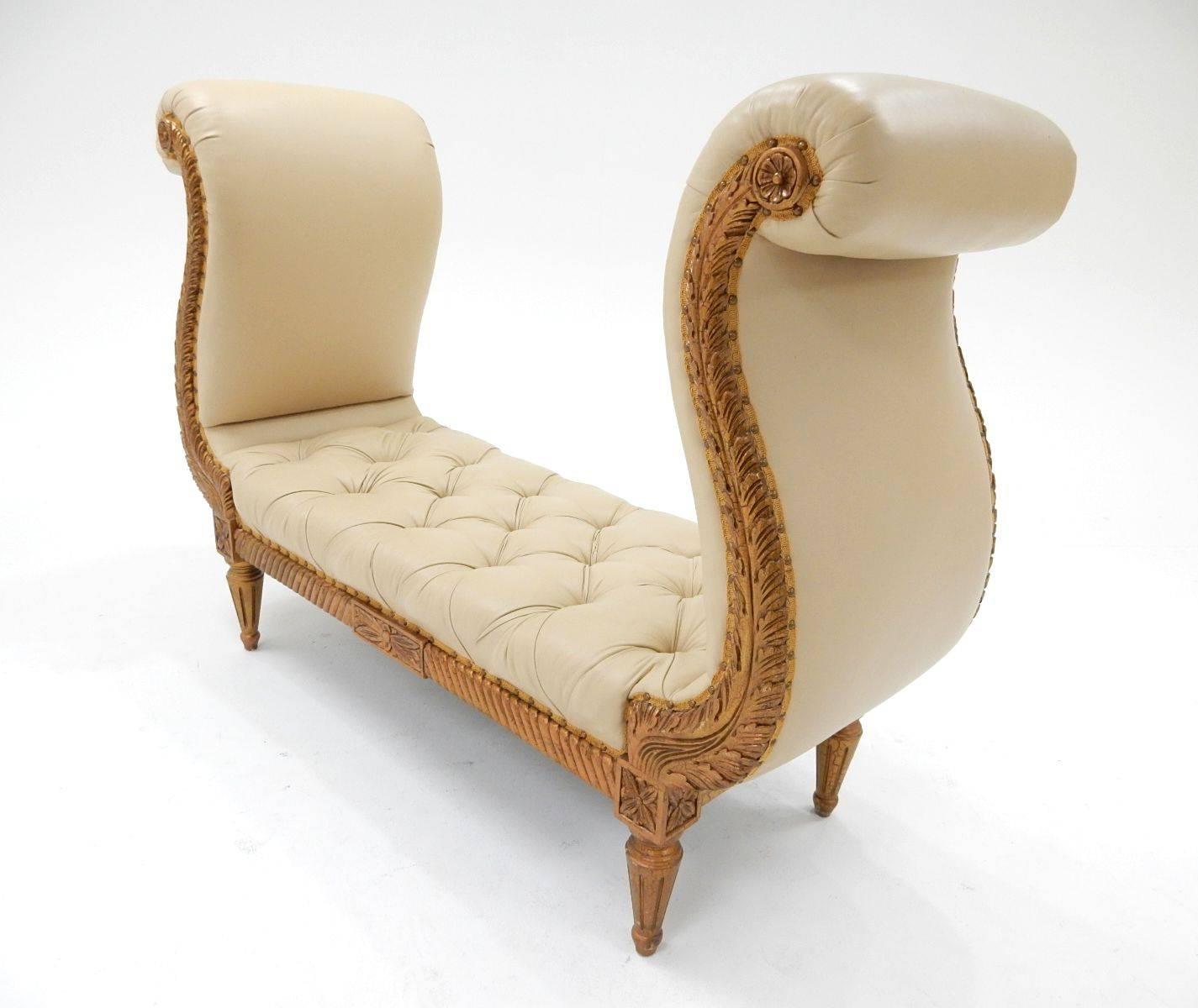 Simply stupendous! The exaggerated "wing" arms on these piece stand over 4 feet tall.
Upholstered in buttery soft tan leather trimmed in nailheads. Gilded wood frame. Condition is amazing.
Over the top statement piece of functional art.