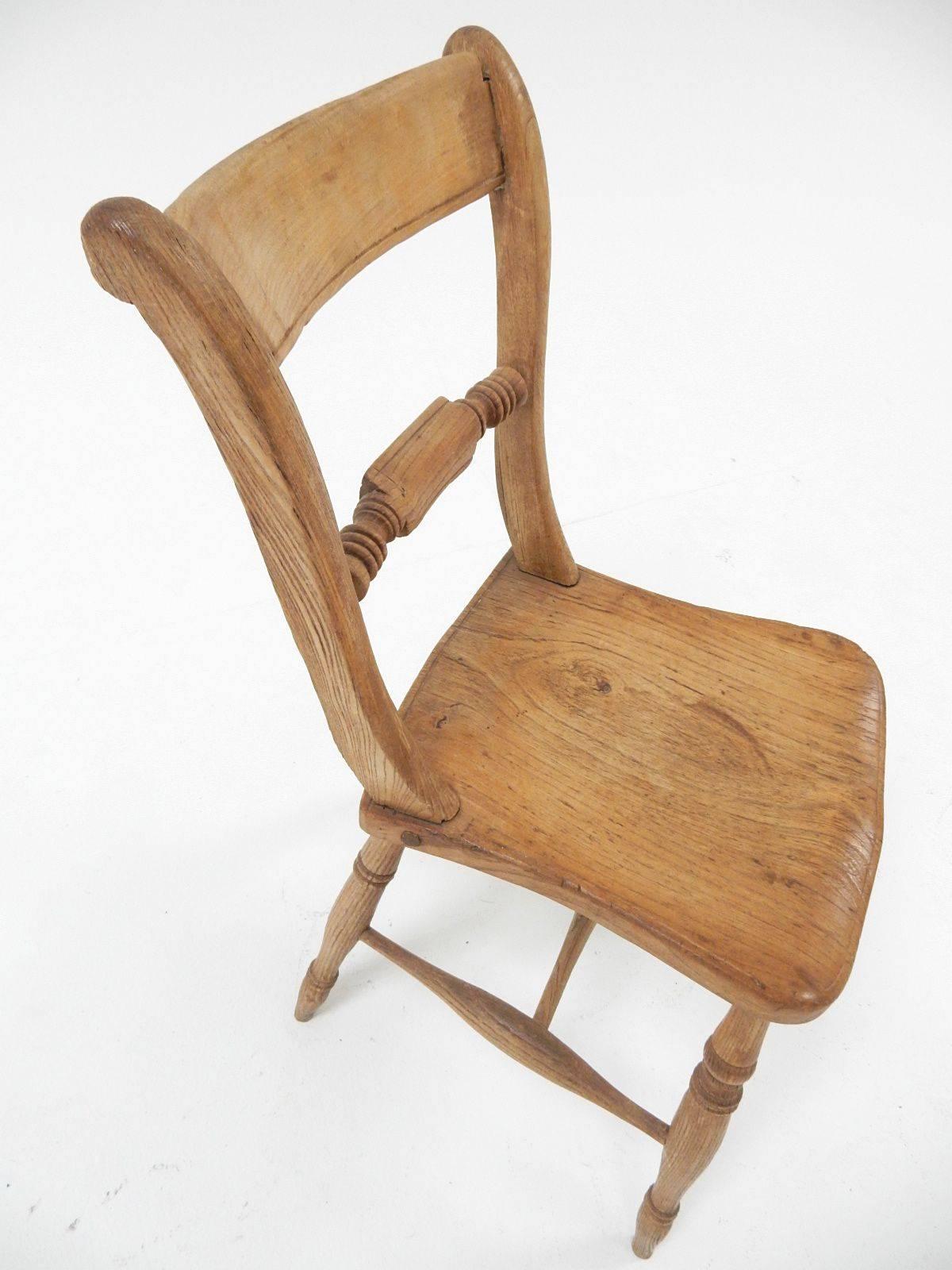 Unique, crudely handcrafted farm chairs, one baring the 