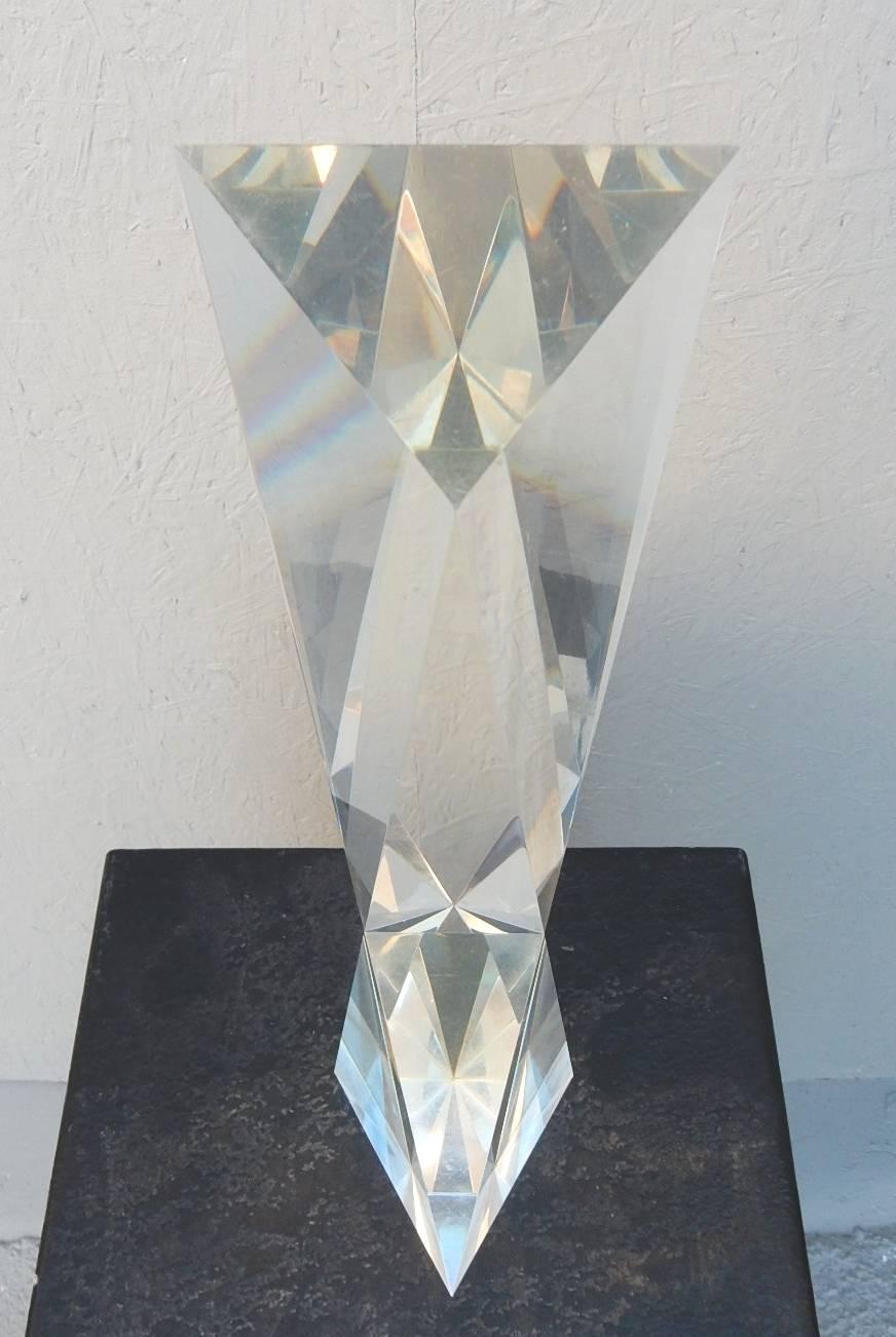 Outstanding 1970s geometric Lucite sculpture by Italian artist Alessio Tasca. Amazing prism affects that splashes a room with rainbow colors when lit. Fabulous!
Stands 22