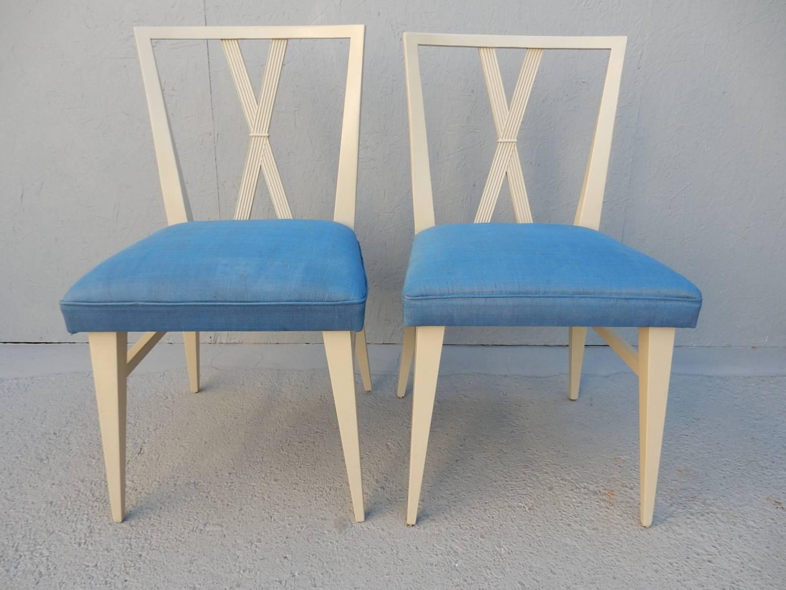 Sexy X-back dining chairs designed by Tommi Parzinger for Charak Modern.
Original light blue silk upholstery. Beautiful chairs, circa 1960.