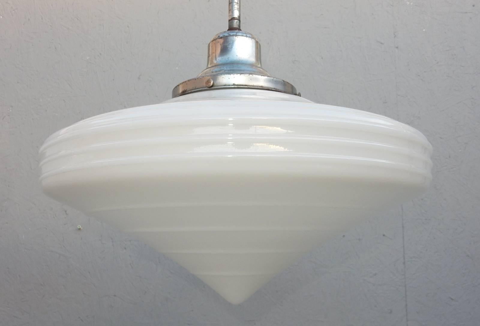 Lovely pair of 1930s commercial size milk glass globe pendant lamps.
Hand spun gorgeous glass shades shaped like a 