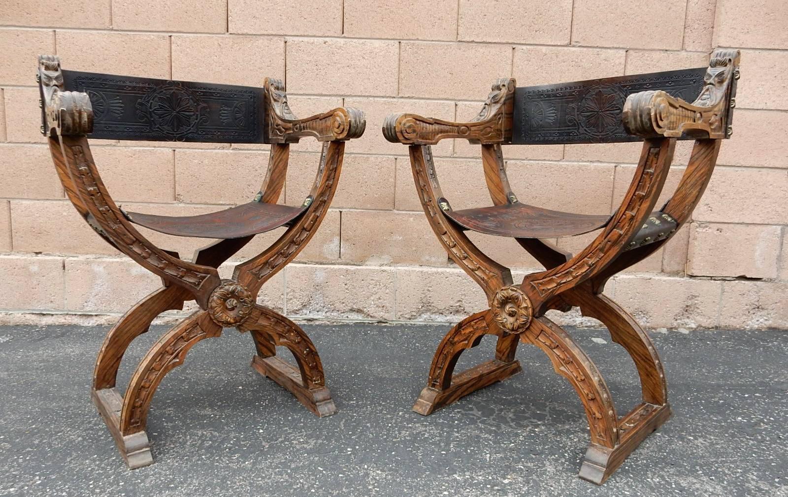 Dining set from Spain or Italy. Gorgeous set of six chairs all hand-carved by artisans with leather set and back attached with decorative bronze studs, circa 1950. The detail of the wood carving and grain is truly amazing.
Table legs are a carved