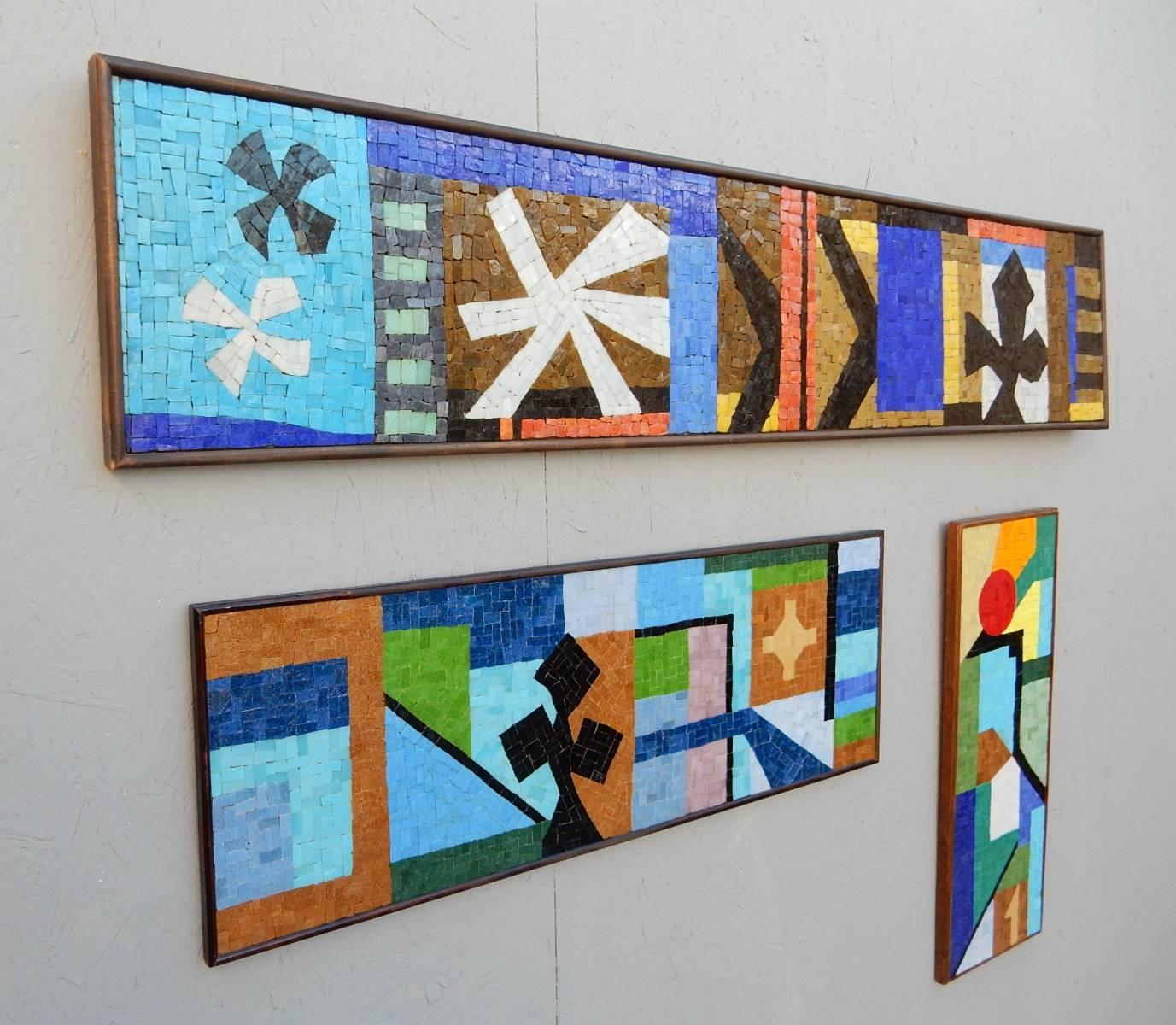 Rare tryptic mosaic art panel sculptures designed by Evelyn and Jerome Ackerman, circa 1950s.
Signed with ERA label on back of largest panel stating Evelyn Ackerman as designer.
All are in mint condition with no missing pieces or repairs.
Panels