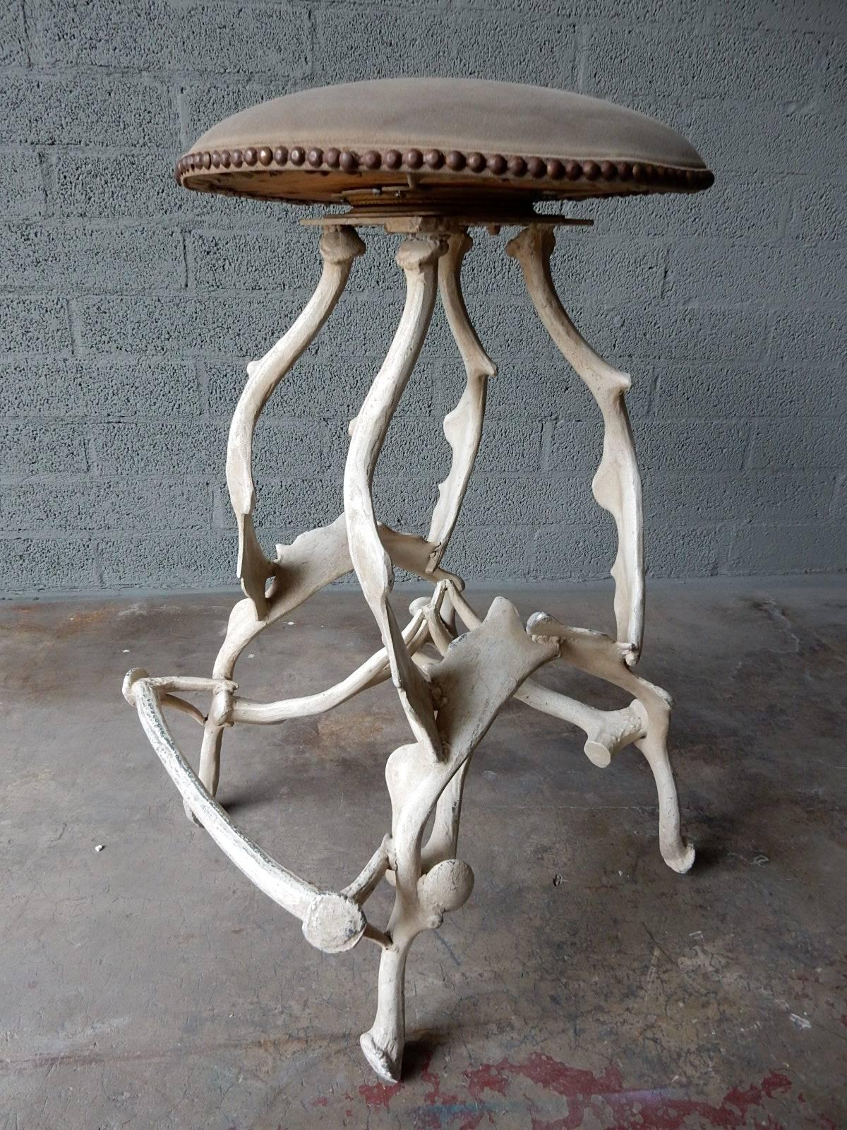 Trio of life-like cast aluminium moose antler bar stools.
Swivel leather-like seats surrounded with brass tack heads. Creamy white enamel with nice aged patina.
As cool as a stool can be.
  