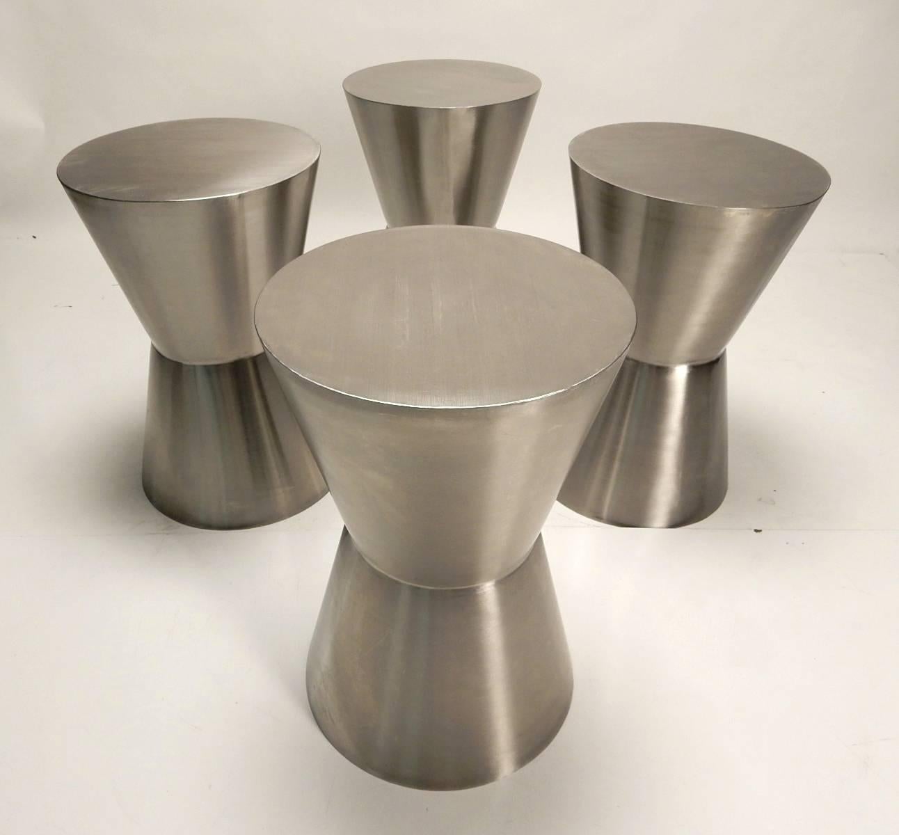 A set of six seamless, brushed stainless steel sculpture hourglass sculptures make the perfect occasional seating or tables.
Each measuring 21-1/4 inch tall X 14 inch wide tops.
Heavy and highly crafted pieces of functional art.
 