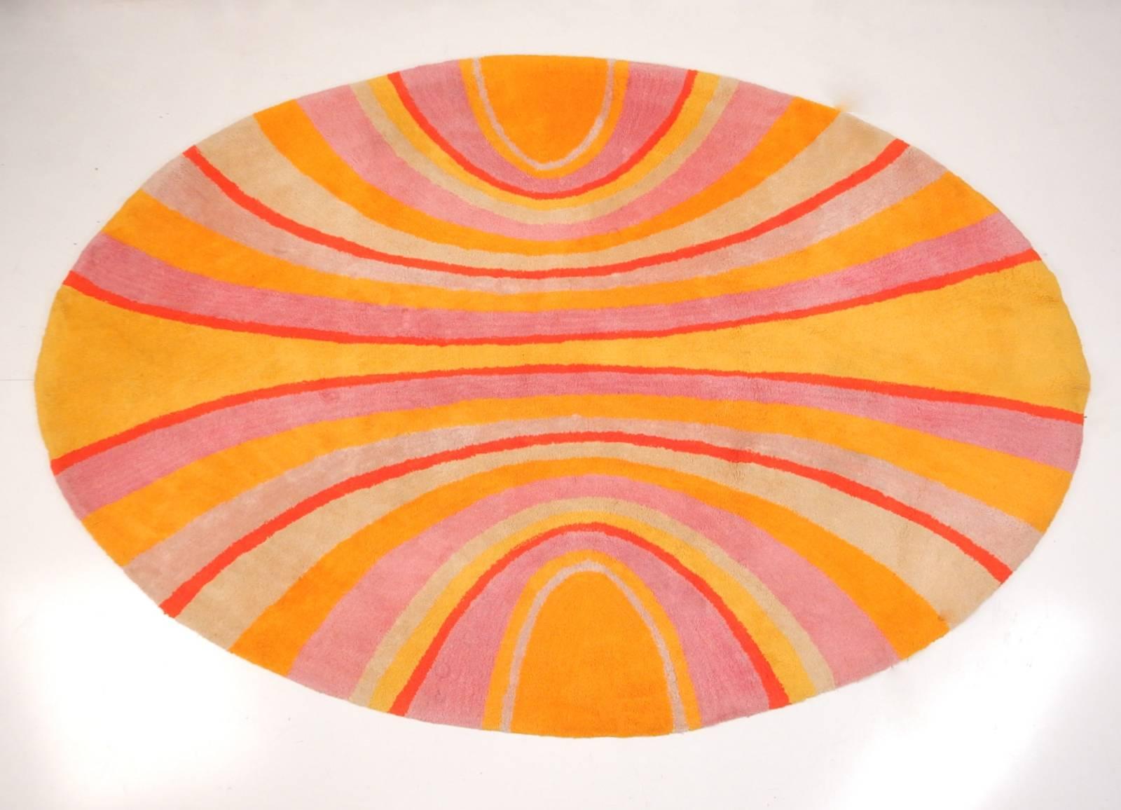 1970s, psychedelic oval shag rug in manner of Verner Panton.
Measures: 8 feet long x 5.5 feet wide in centre. Deep pile with bold, bright, mesmerizing colors.
Rectangular V'Soske label is missing on back (you can see where it once was).