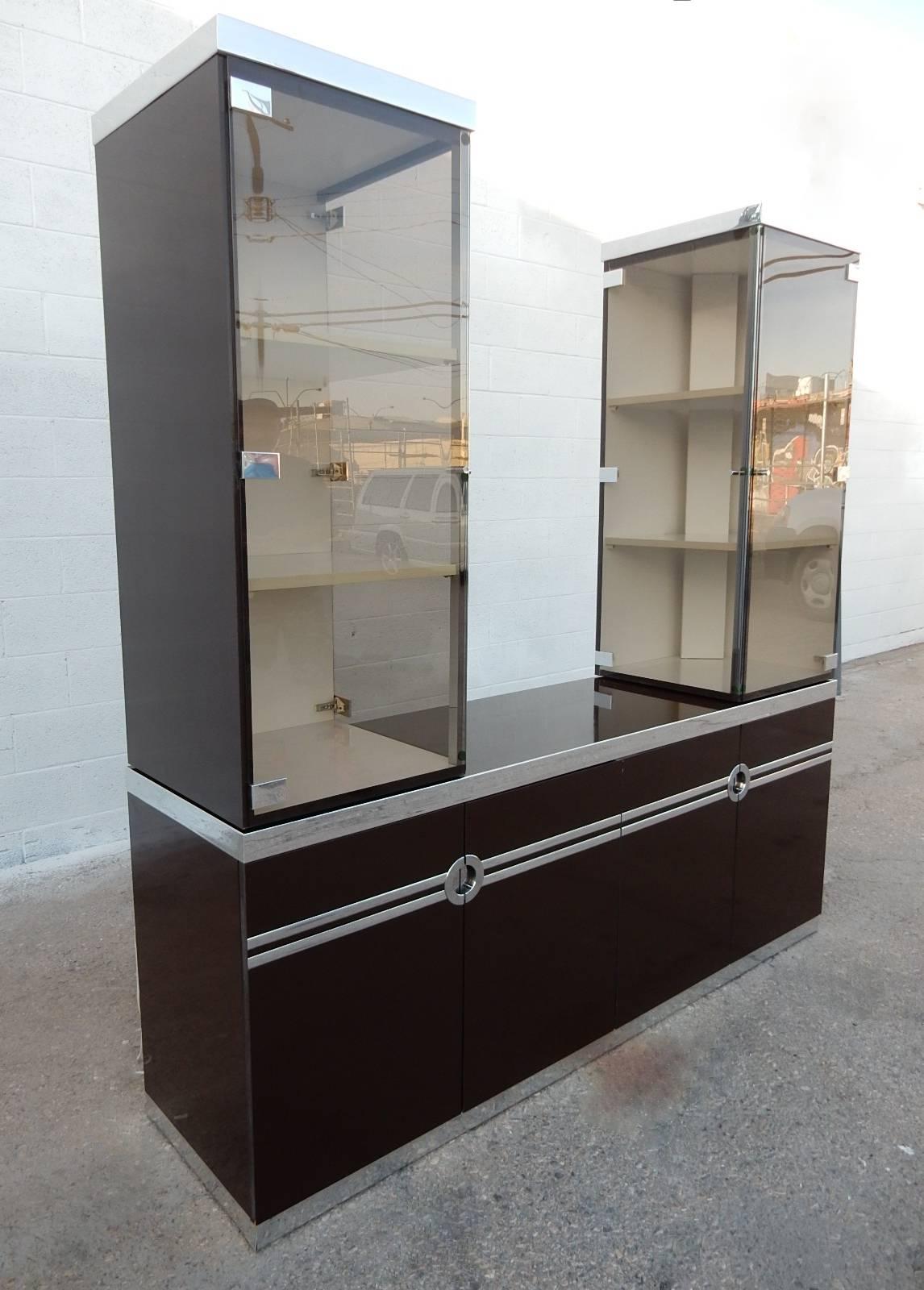 Willy Rizzo design for Pierre Cardin buffet with rare additional
lighted glass tower hutches on either side. 
Towers open from both front and inner side via glass doors.
Backs are finished on the towers.
Coco color with polished aluminum trim.