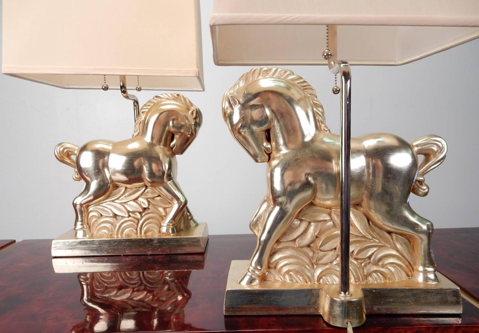 Art Deco inspired Etruscan horse table lamps in a gorgeous polychromatic silver finish.
Chrome hardware with rectangular box shades. Premium quality lamps that
would lend well to an eclectic decor.