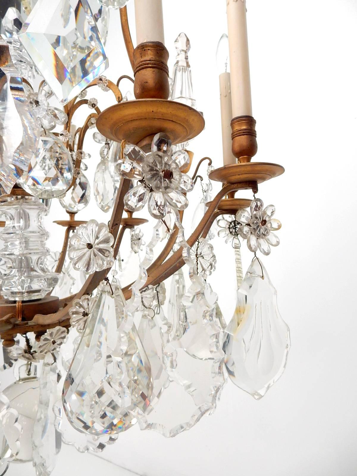 Spectacular French 19th century Napoleon era crystal chandelier. 
This is a very large and heavy gold gilded chandelier with massive clear stone crystals.
Nine candle bulbs.
From a vintage Beverly Hills estate.