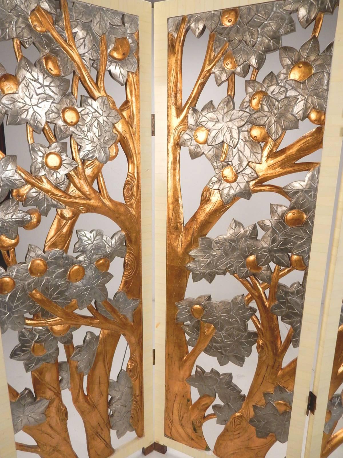 Art Nouveau style gold and silver leaf, fruit tree relief room divider/screen,
circa 1970s-1980s.
A gorgeous piece of functional art with hand applied gold and silver leaf that delightfully glows in light. Cut out design allowing 