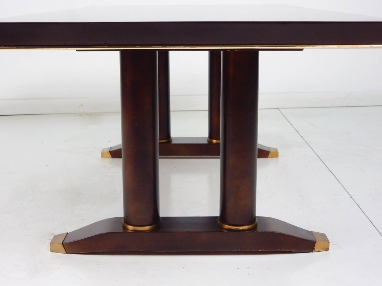 Mid-20th century mahogany coffee table by Batistin Spade (1891-1969) of Paris.
This is an exceptionally rare rectangular bronze trimmed coffee table. 
Bronze rings on base of leg columns and capped feet.
Marked B. Spade Decorateur Paris on