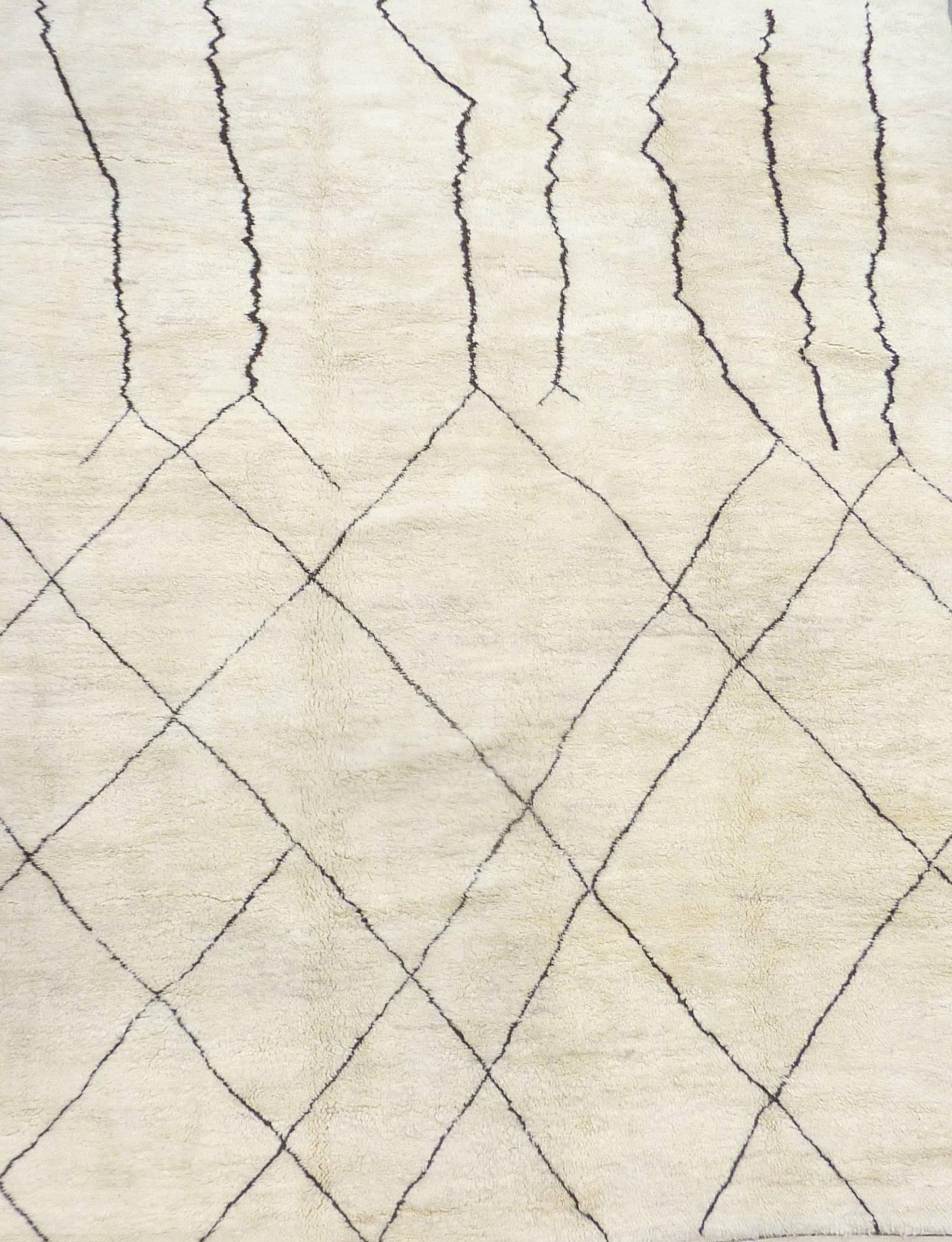Soft, ivory carpet. Moroccan, Beni Ourain carpets are woven from un-dyed natural wool and traditionally decorated with geometric designs. These magnificent rugs have the fascinating ability to connect the long history of the nomadic Berber tribes