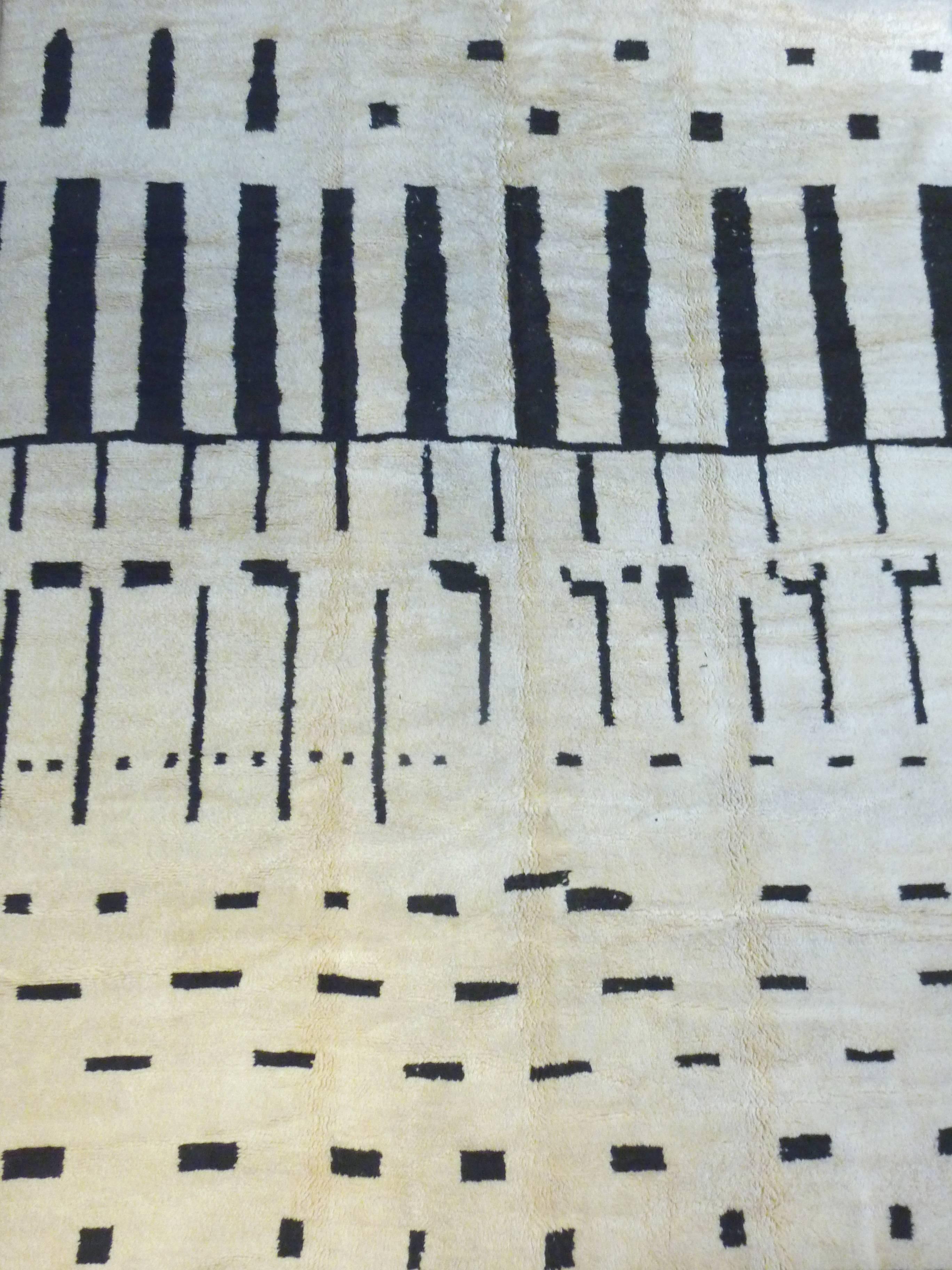 Soft, ivory carpet. Moroccan, Beni Ourain carpets are woven from un-dyed natural wool and traditionally decorated with geometric designs. These magnificent rugs have the fascinating ability to connect the long history of the nomadic Berber tribes