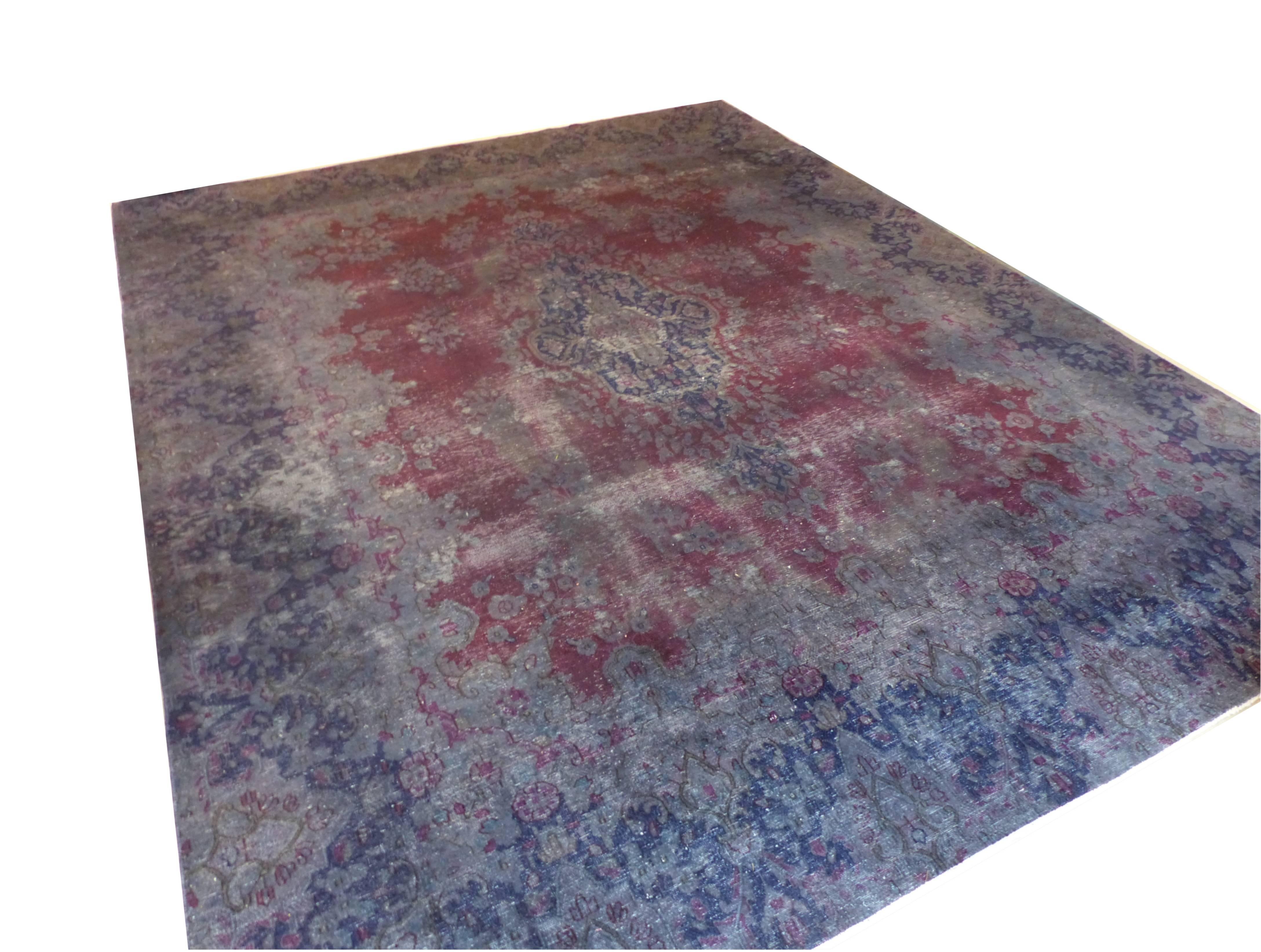 Large Persian rug hand-knotted during the 1970s. Industrial look. Deliberately worn. However this carpet is sturdy. No holes or wears of chains and wefts. Recently redyed in a grey-blue color. The colors are soft and stabile; No chemical dyes. Suits