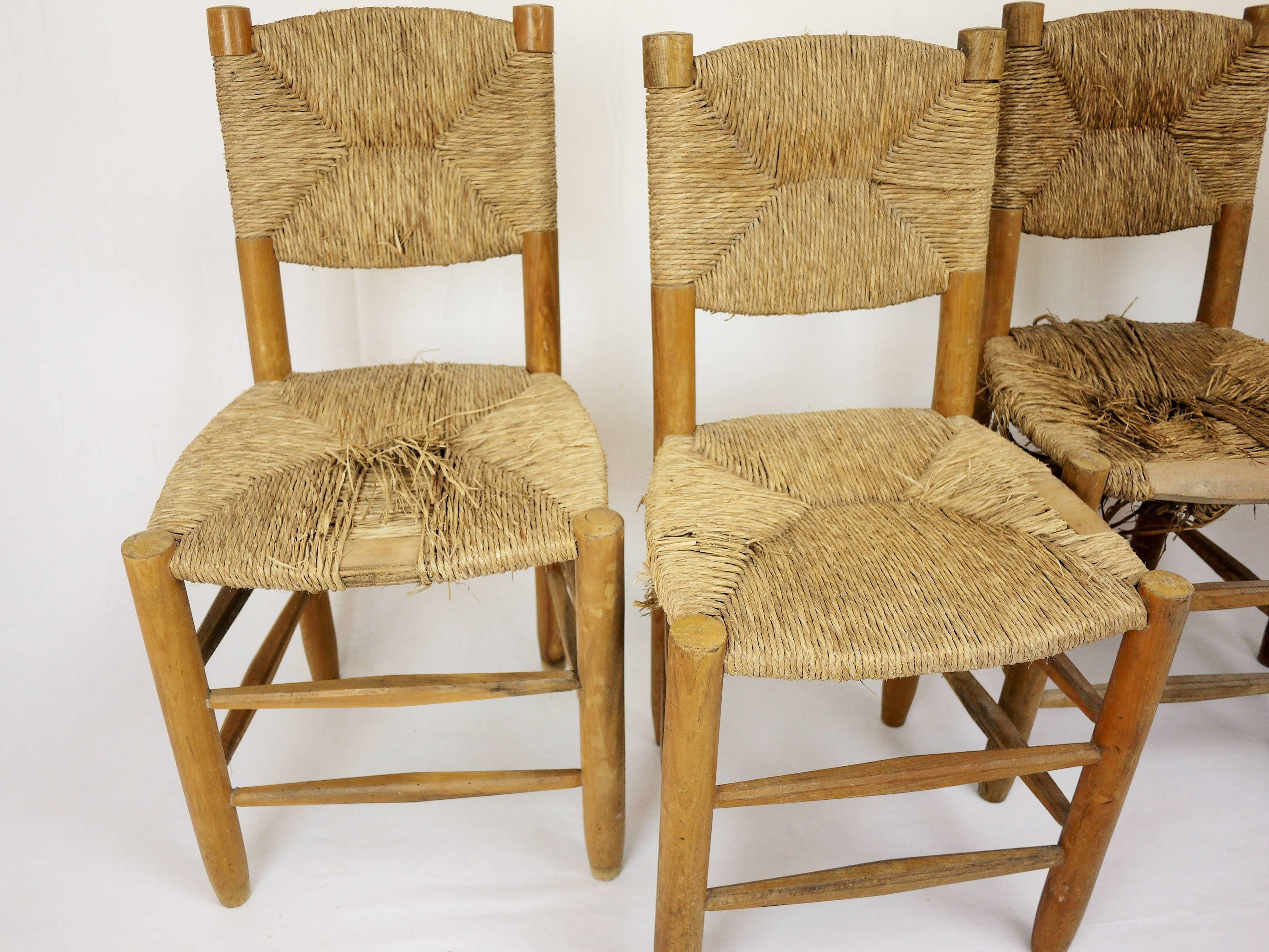 Set of Four Rush Chairs by Charlotte Perriand In Fair Condition For Sale In POITIERS, FR