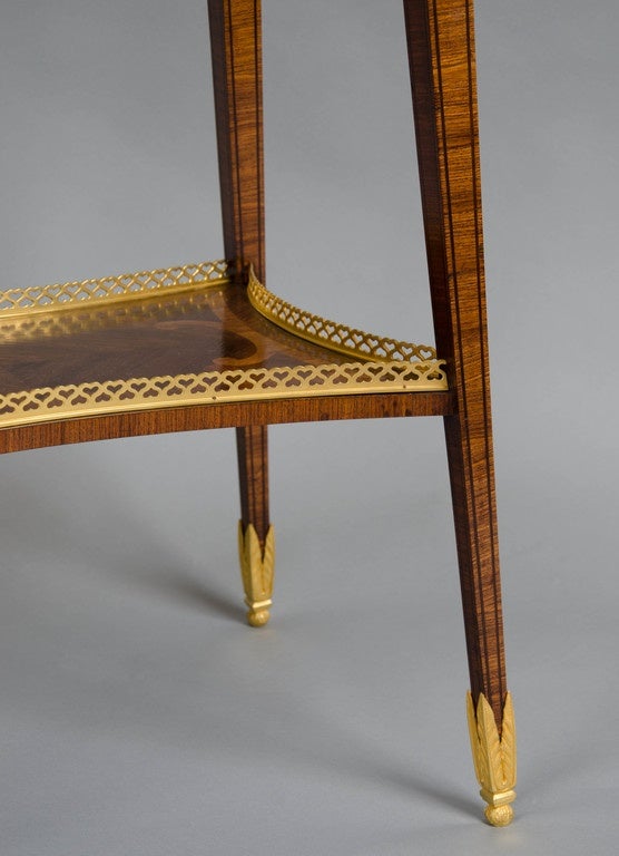 A lovely rosewood patience table with gilt gallery and mounts, inlaid with exotic wood.