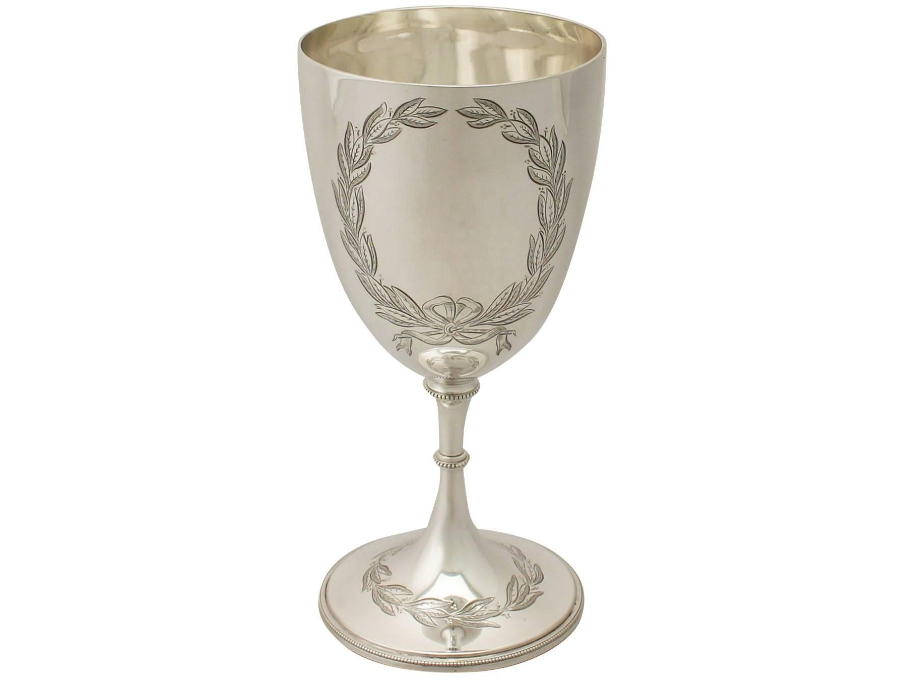 An exceptional, fine and impressive antique Victorian English sterling silver wine goblet; an addition to our collection of wine and drinks related silverware.

This exceptional antique Victorian sterling silver wine goblet has a circular bell