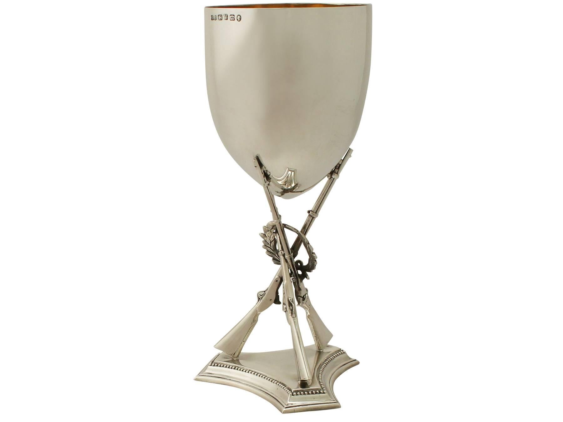 An exceptional, fine and impressive antique Victorian English sterling silver goblet with shooting/rifle interest; an addition to our diverse presentation silverware collection.

This exceptional antique Victorian sterling silver goblet has a