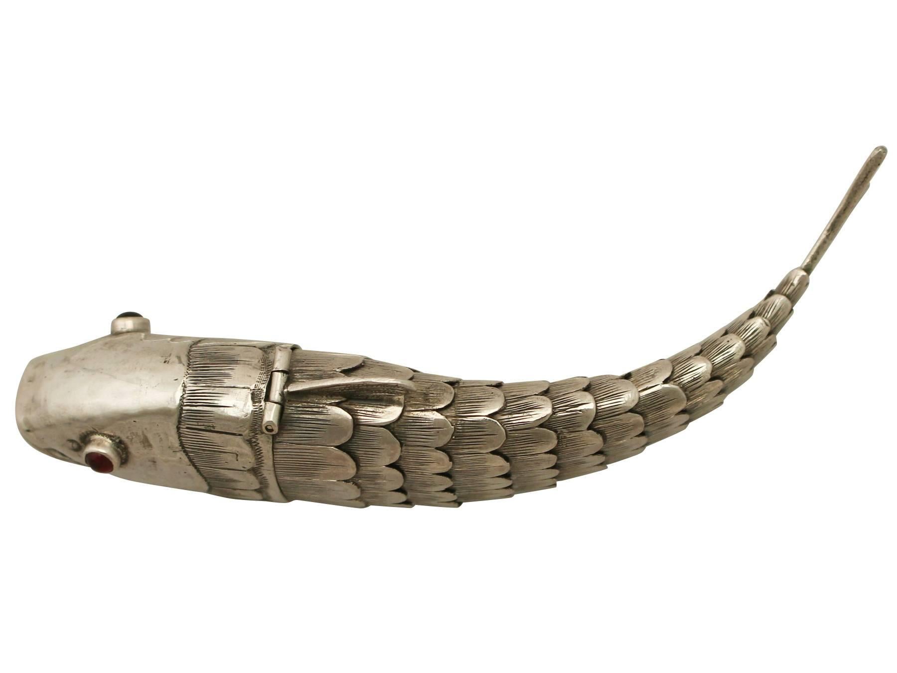 An exceptional, fine and impressive antique German silver spice box realistically modelled in the form of a fish; an addition to our animal related silverware collection.

This exceptional antique German 800 standard silver spice box has been