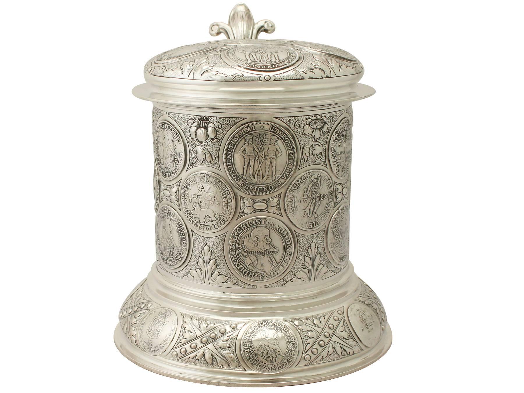 An exceptional, fine and impressive, large antique German 800 standard silver quart and a half coin tankard; an addition to our range of collectable silverware.

This exceptional antique German 800 standard silver tankard has a plain tapering