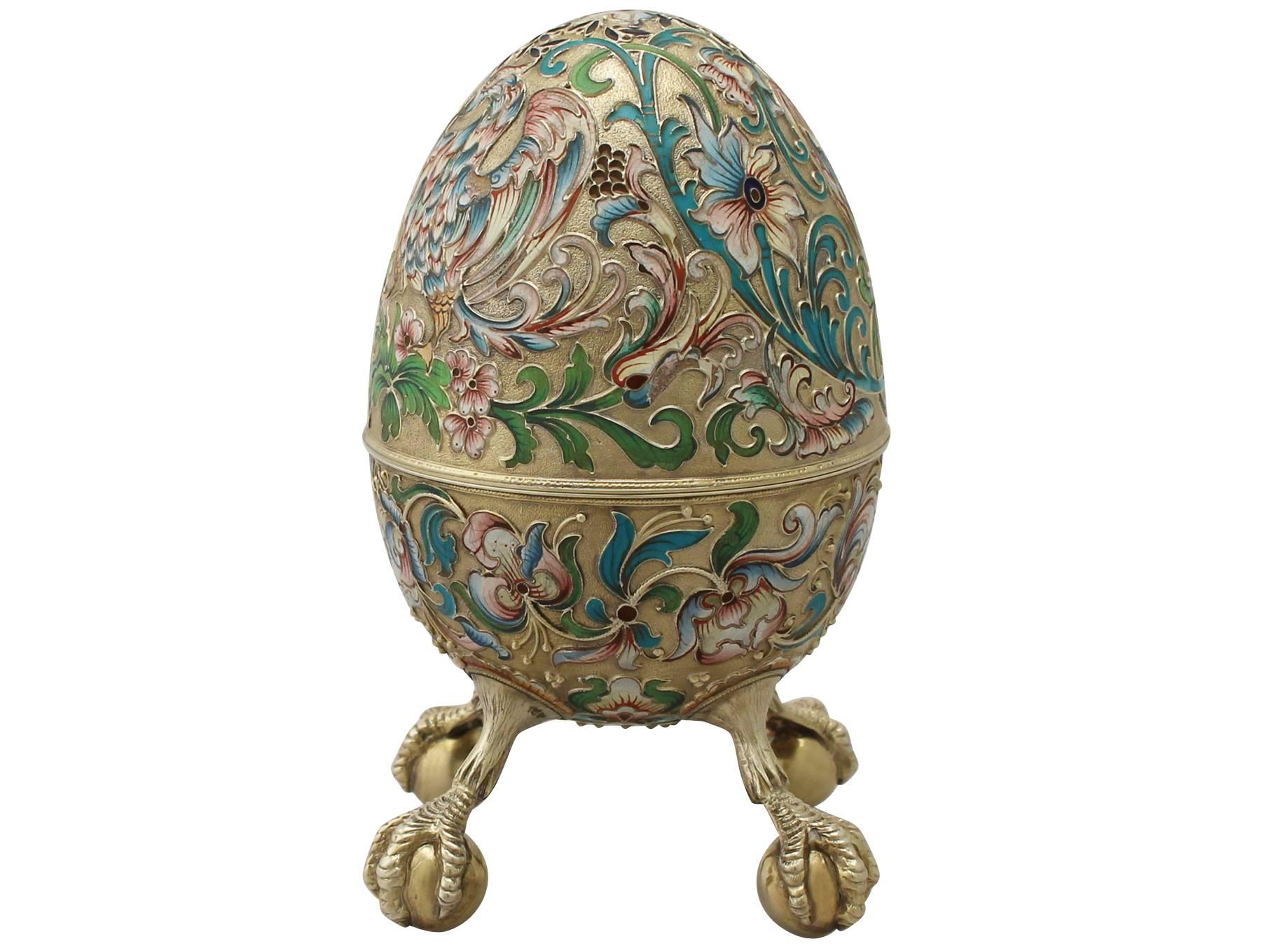 A magnificent, fine and impressive, composite pair of antique Russian silver gilt polychrome cloisonné enamel eggs; an addition to our ornamental silverware collection.

These magnificent antique Russian silver gilt boxes have an ovoid egg shaped