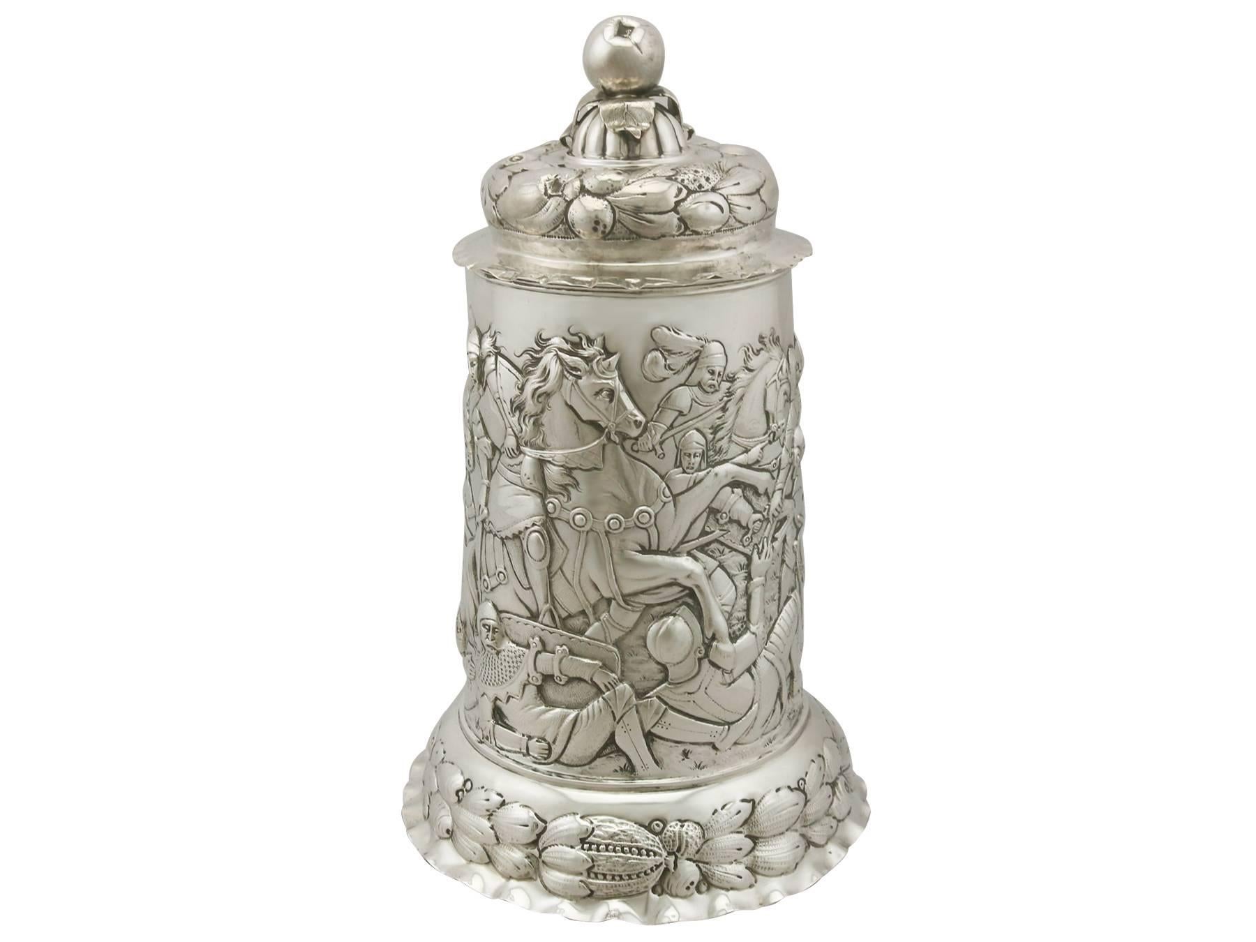 An exceptional, fine and impressive antique German silver quart tankard; an addition to our range of collectable silverware

This exceptional antique German silver tankard has a plain tapering cylindrical form onto a circular shaped domed