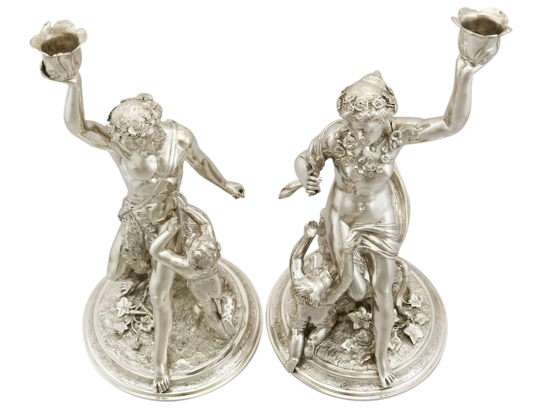 A magnificent, fine and impressive pair of antique Victorian English cast sterling silver figural candlesticks; an addition of our ornamental silverware collection

These magnificent antique Victorian cast sterling silver candlesticks have been