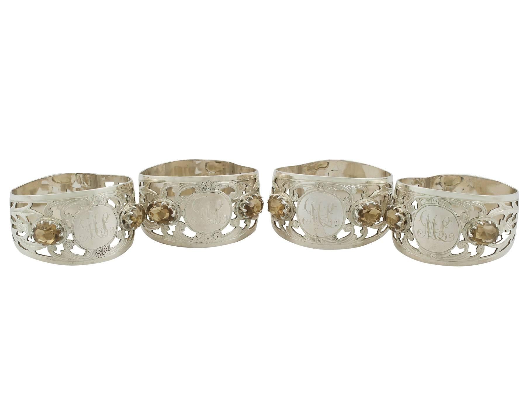 An exceptional, fine and impressive set of four antique George V English sterling silver and smoky topaz napkin rings - boxed; an addition to our dining silverware collection

This exceptional set of antique George V sterling silver napkin rings