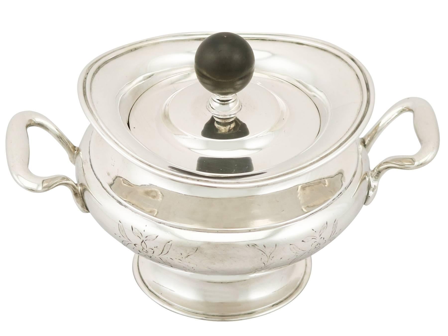 A fine and impressive antique Russian silver sugar bowl and cover; an addition to our diverse silver teaware collection

This impressive antique Russian silver sugar bowl has an oval rounded form onto a spreading foot.

The surface of the