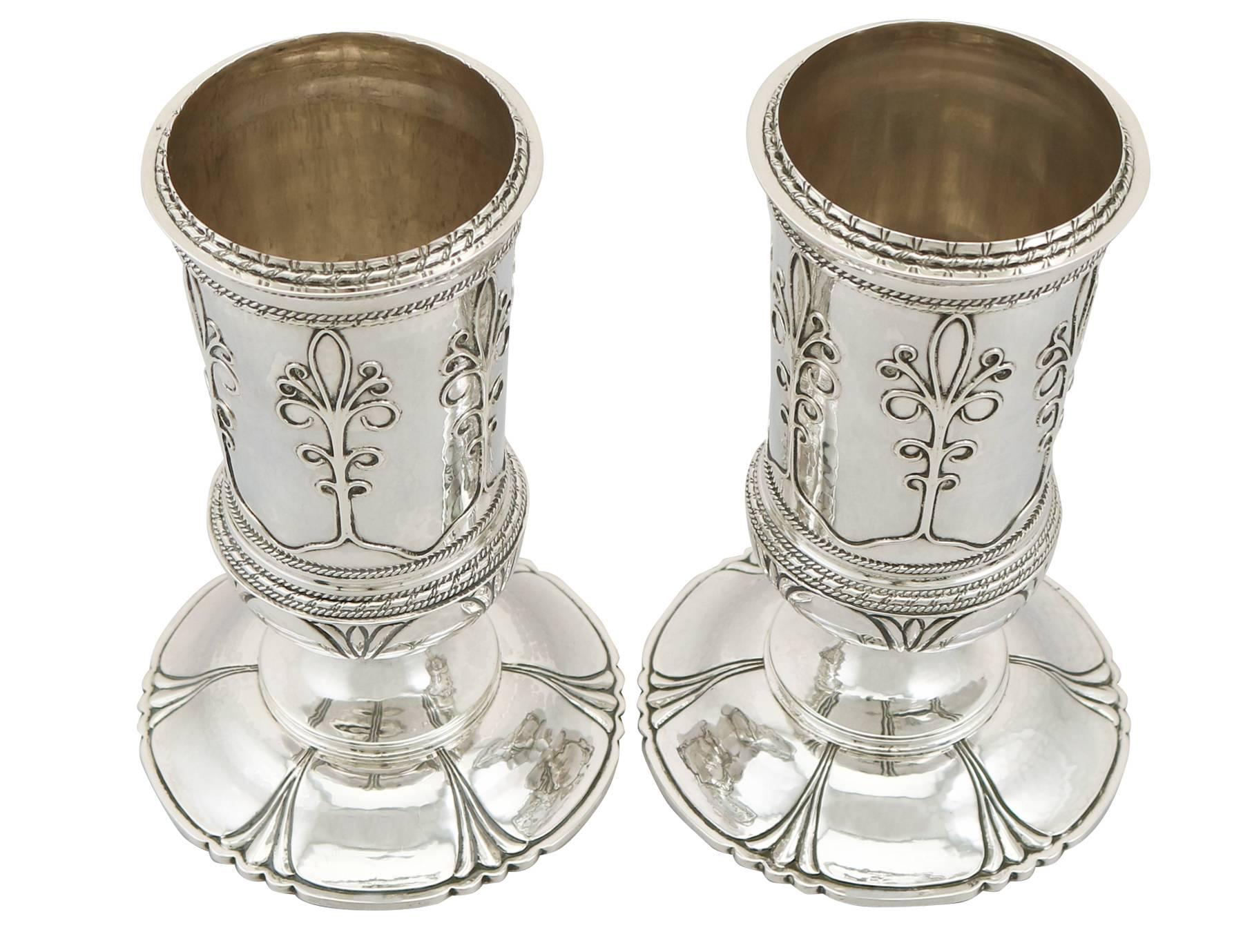 An exceptional, fine and impressive pair of antique George V English sterling silver vases made in the Arts and Crafts style by Guild of Handicraft; an addition to our ornamental silverware collection

These exceptional antique George V sterling