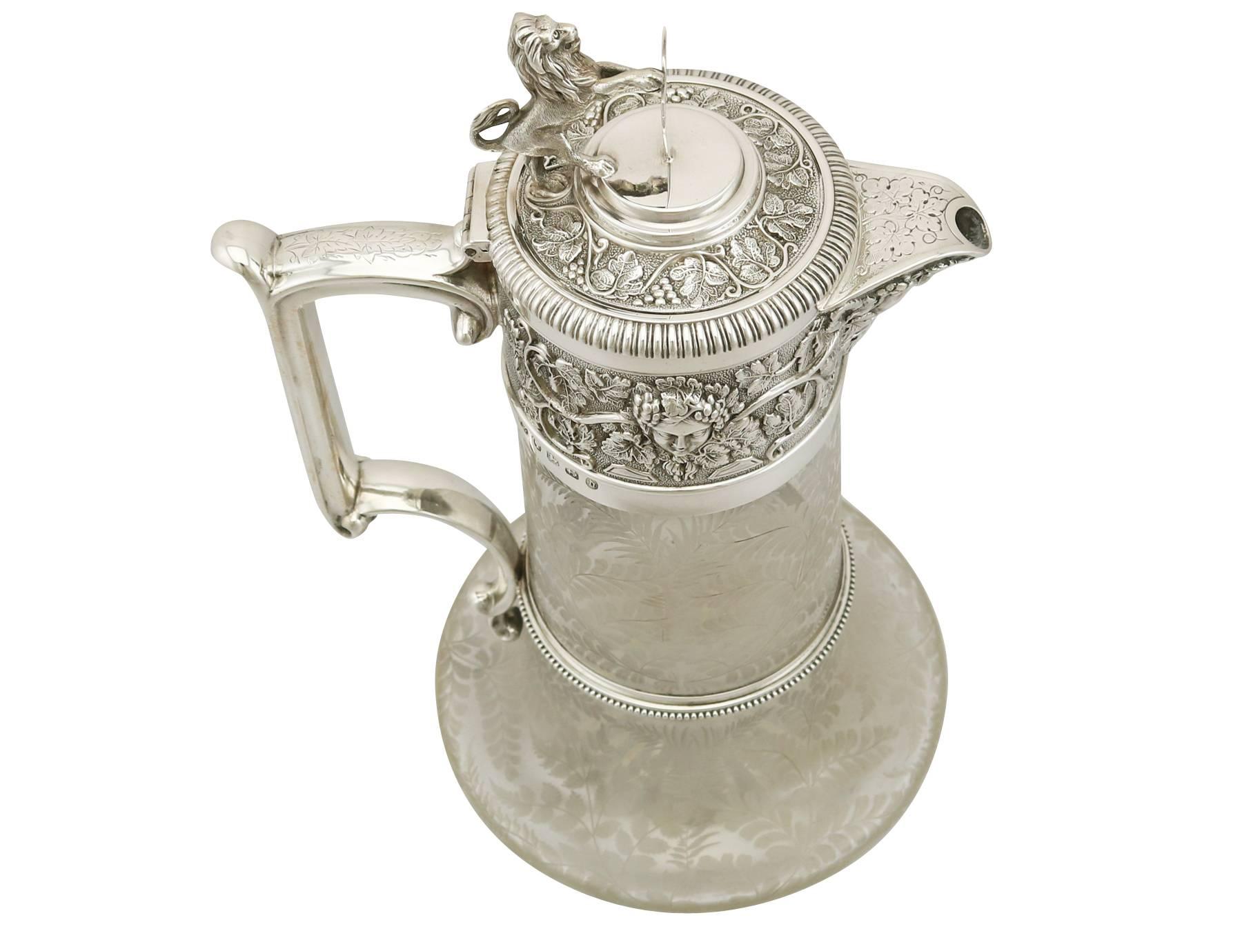 A magnificent, fine and impressive antique Victorian glass and English sterling silver mounted claret jug; part of our silver mounted glass collection

This magnificent antique Victorian glass and sterling silver mounted claret jug has a tapering