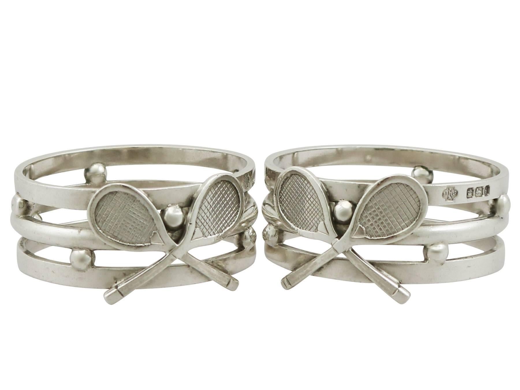 An exceptional, fine and impressive, pair of unusual antique Edwardian English sterling silver napkin rings with tennis interest; an addition to our collection of dining silverware.

These exceptional pair of antique Edwardian sterling silver