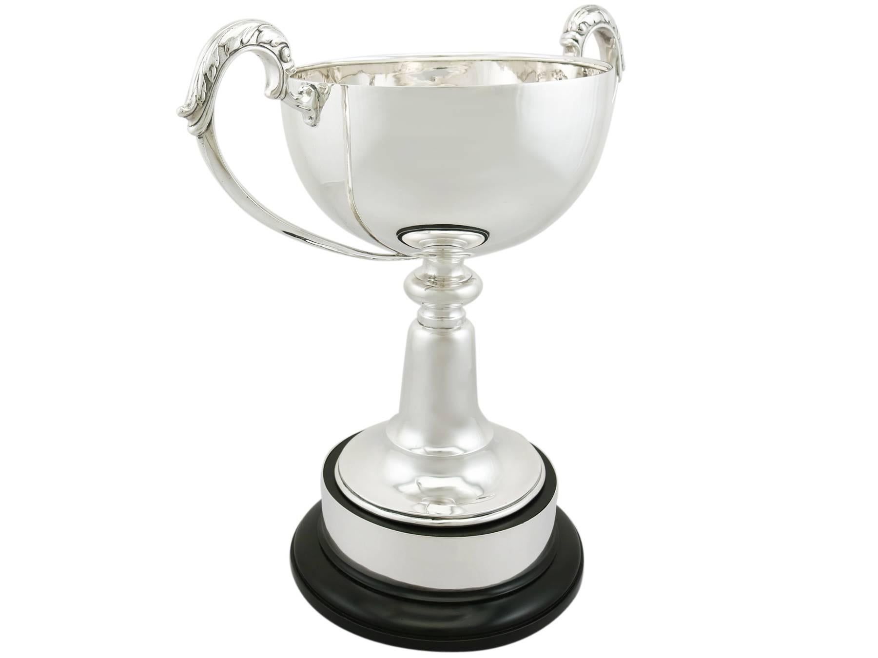 An exceptional, fine and impressive antique George V English sterling silver presentation cup; an addition to AC Silver's presentation silverware collection.

This exceptional antique sterling silver presentation cup has a circular rounded form to